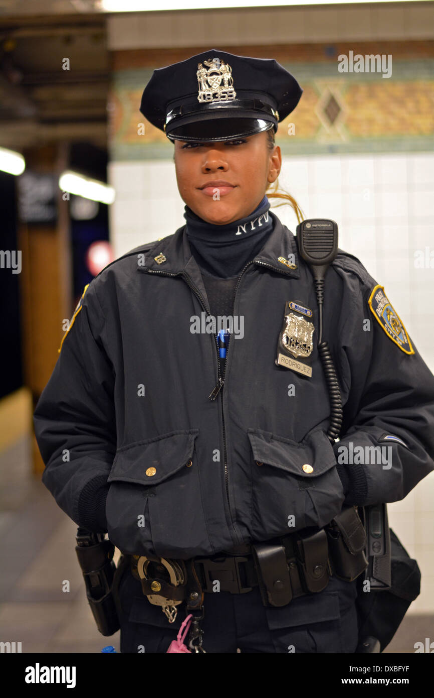 Portrait of New York City police officer Rodriguez on the 34th Street subway platform in Midtown Manhattan, New York City. Stock Photo