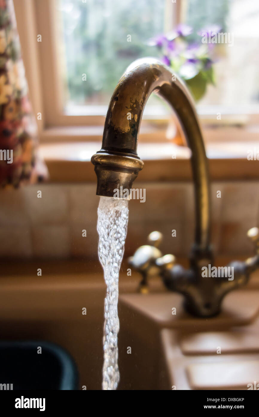 Kitchen tap running water studio Stock Photo