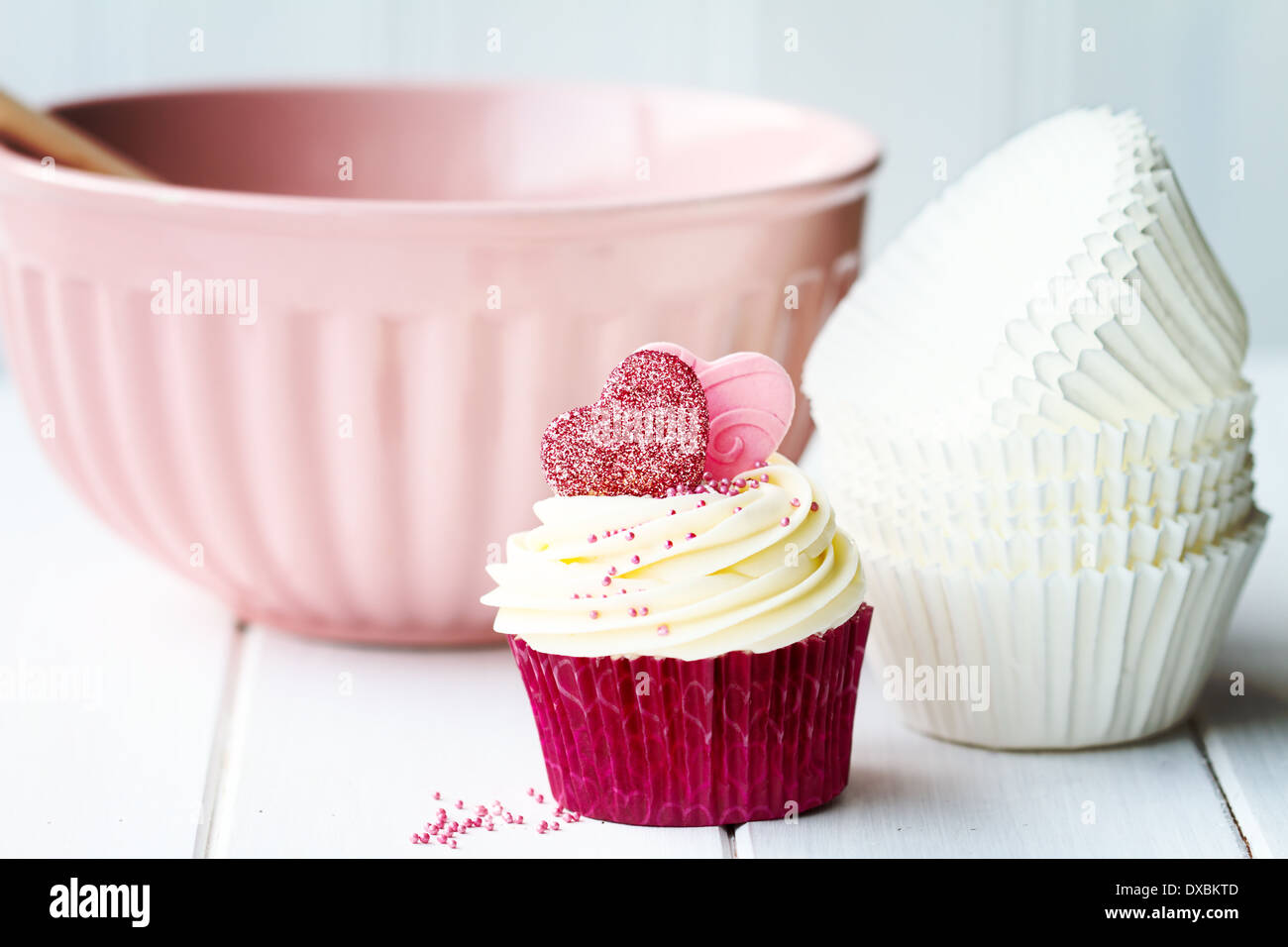 Cupcake and baking bowl Stock Photo