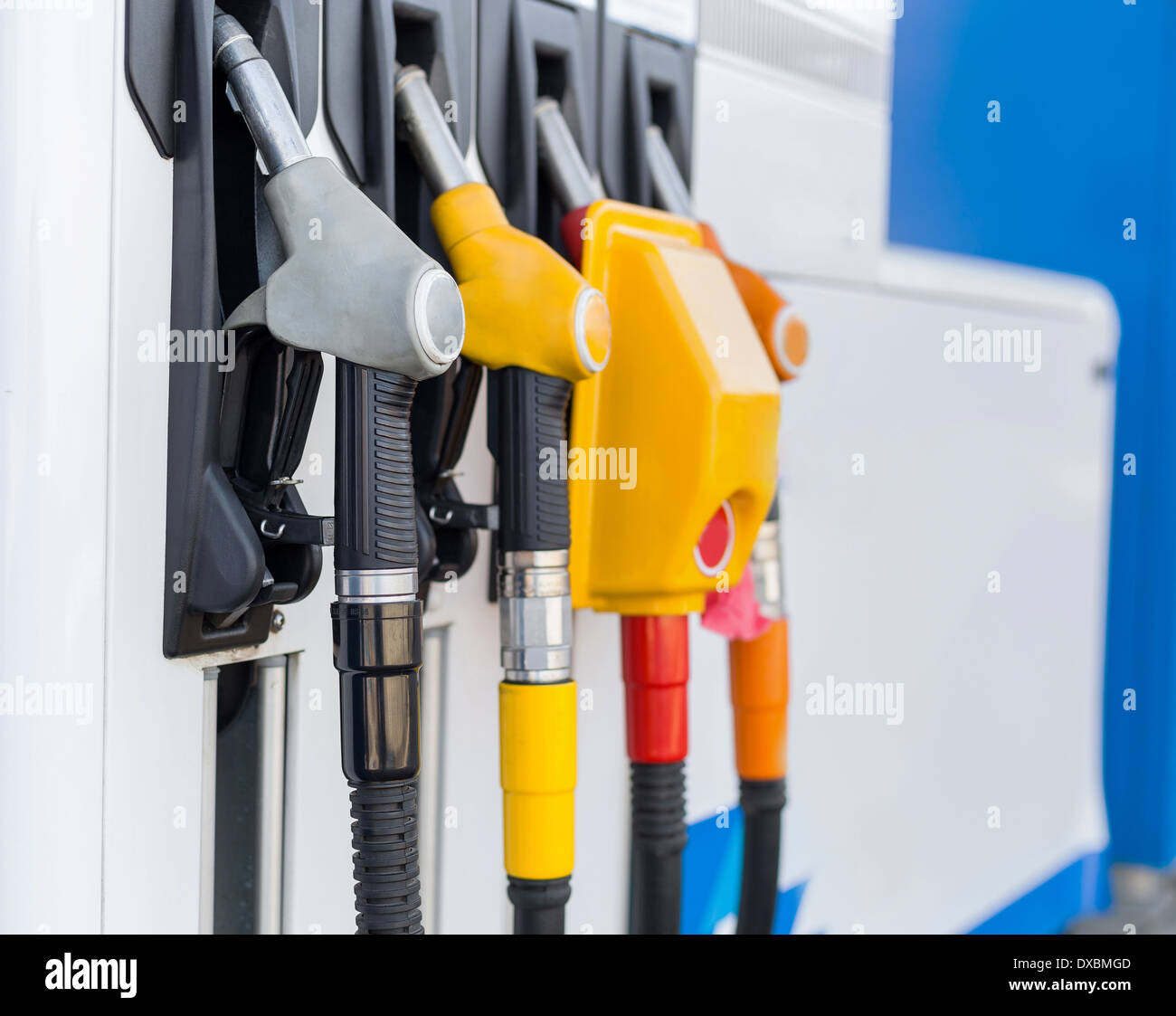 Pump nozzles at the gas station Stock Photo - Alamy