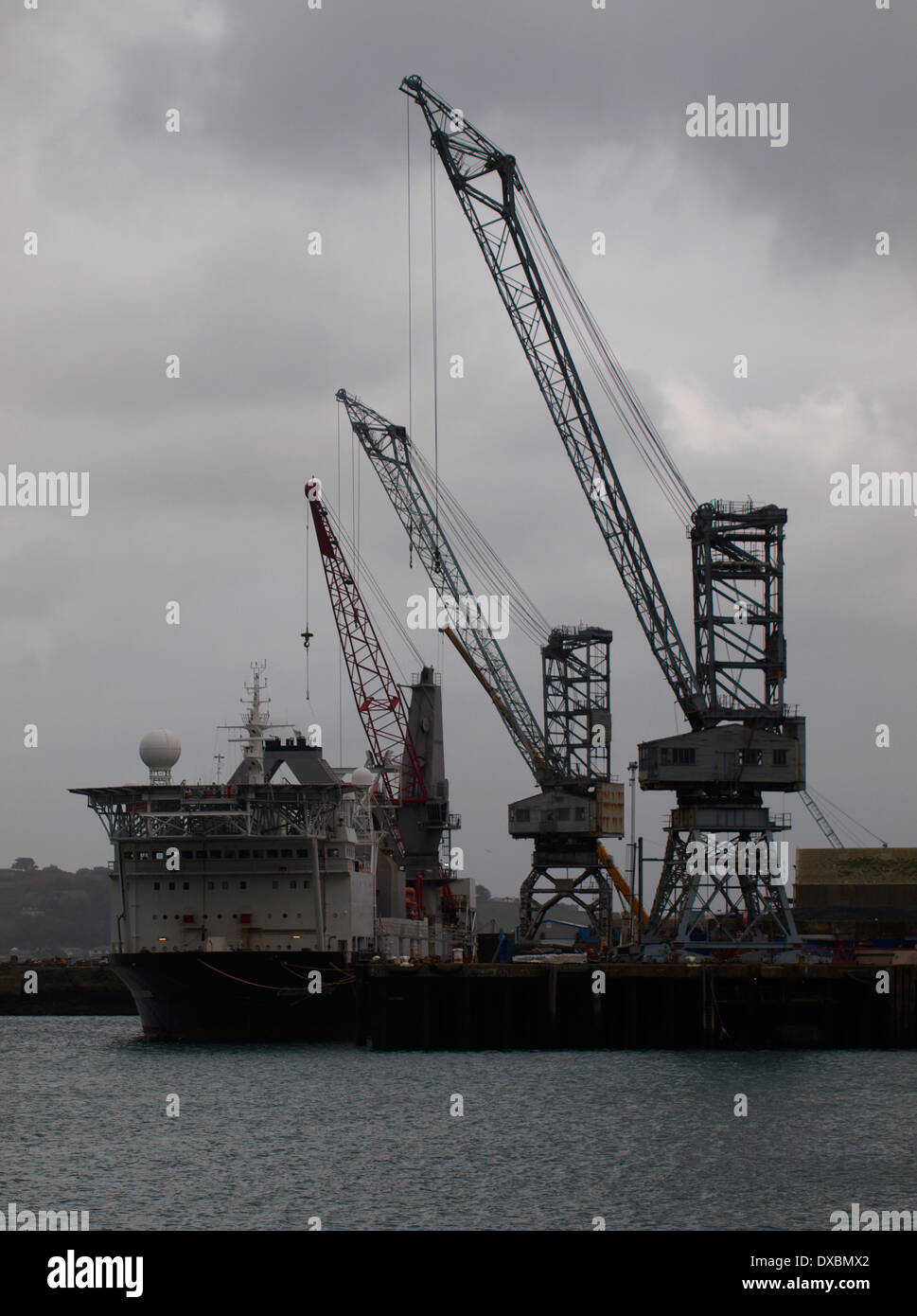Cranes over Falmouth Dockyard on a grey day, Cornwall, UK Stock Photo