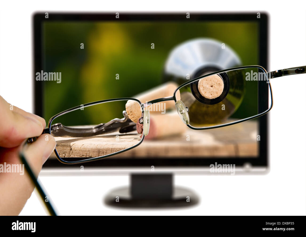 Man is viewing to wine bottle on display through eyeglasses Stock Photo