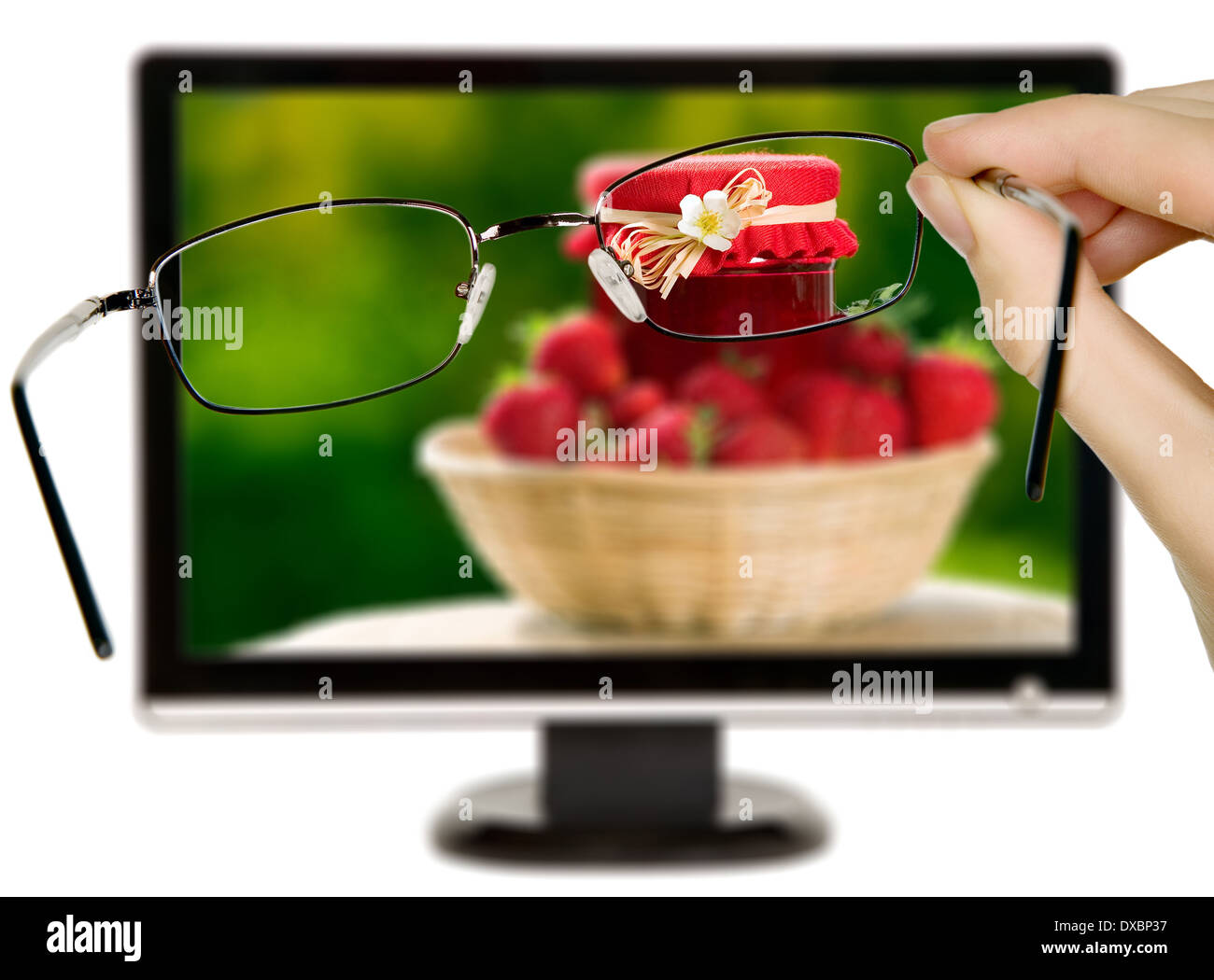 Man is viewing to strawberries on display through eyeglasses Stock Photo