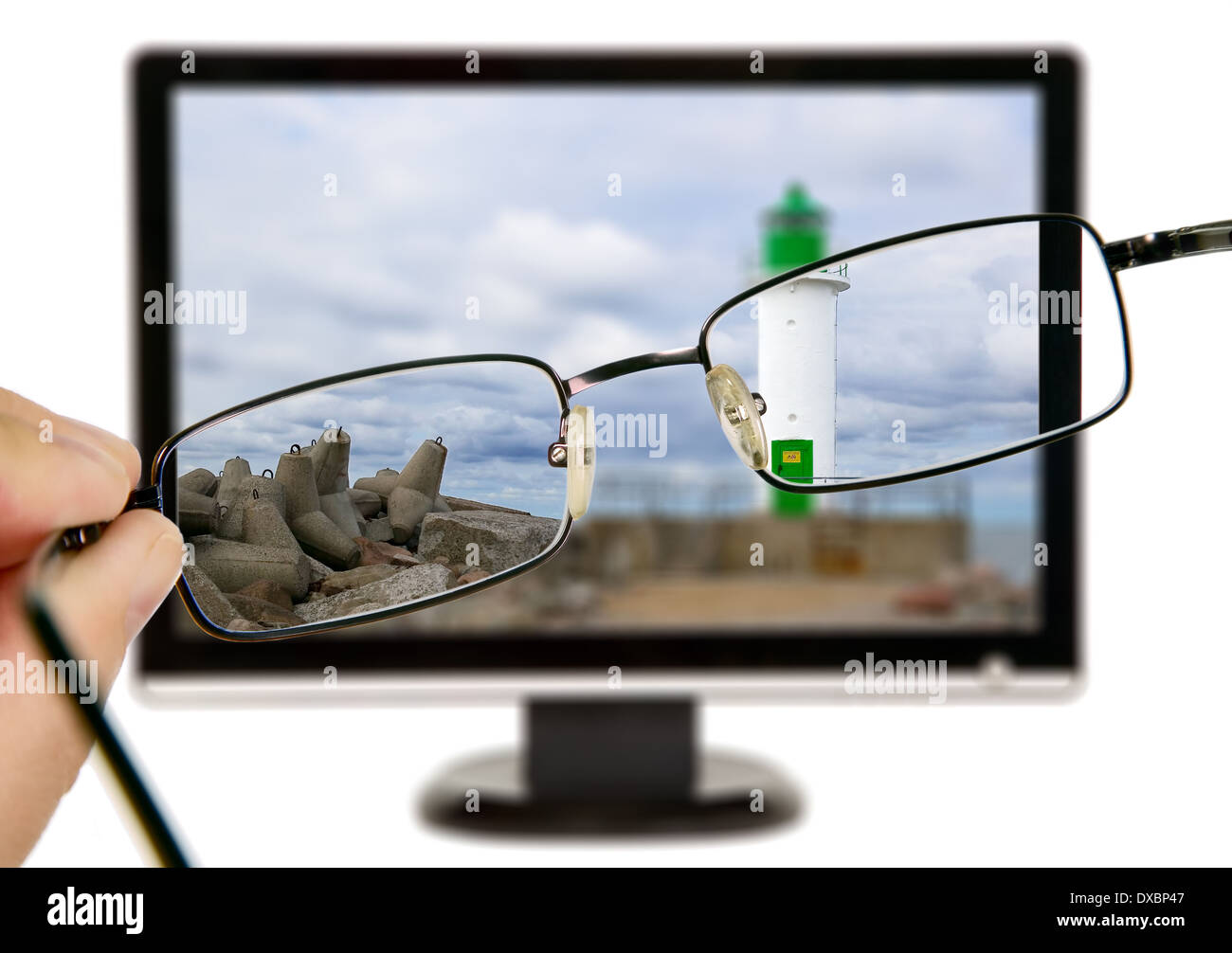 Man is viewing to lighthouse on display through eyeglasses Stock Photo