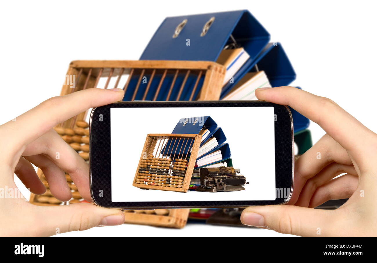 Man is taking photo of documents and abacus with smart mobile phone Stock Photo