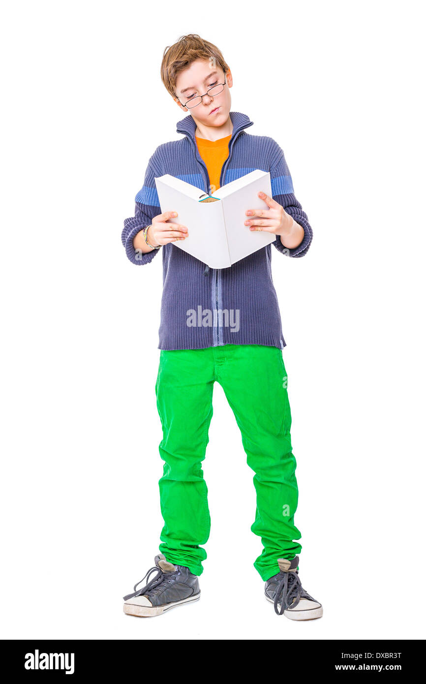 standing teenager with glasses reading a book, isolated on white Stock ...