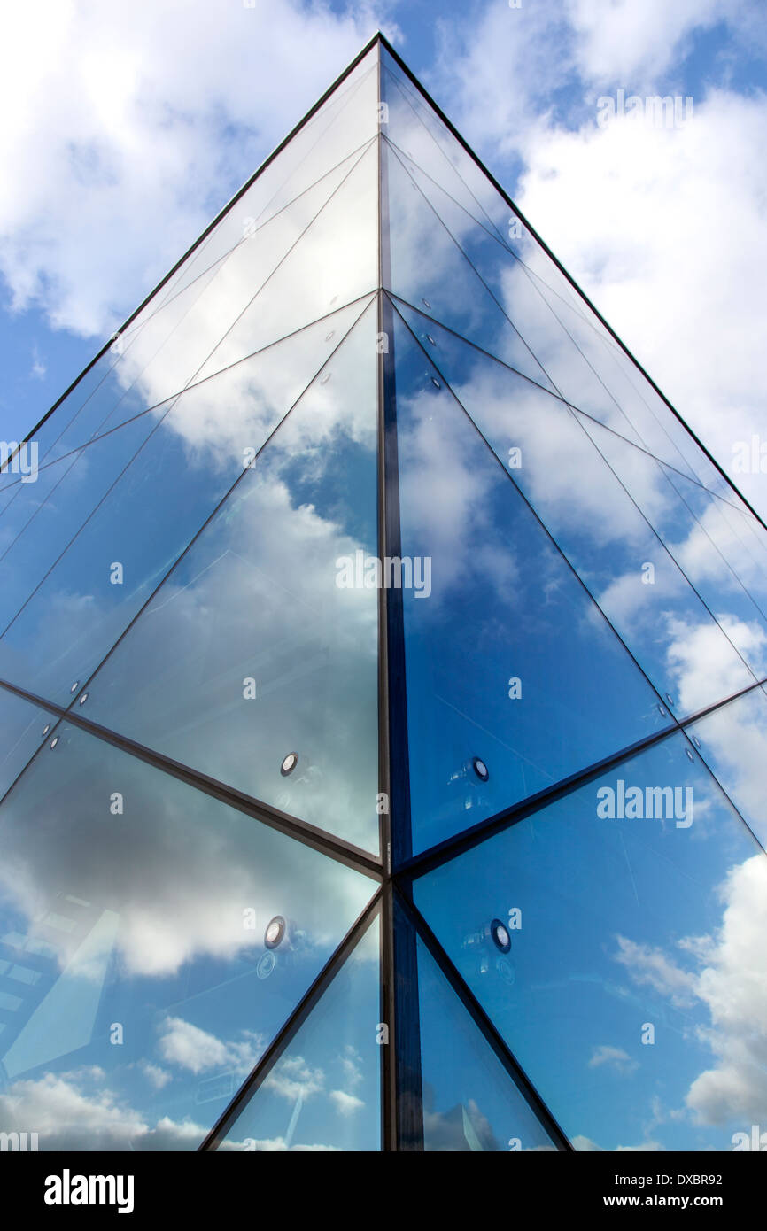 reflexions of clouds and blue sky in glass facade of modern building ...