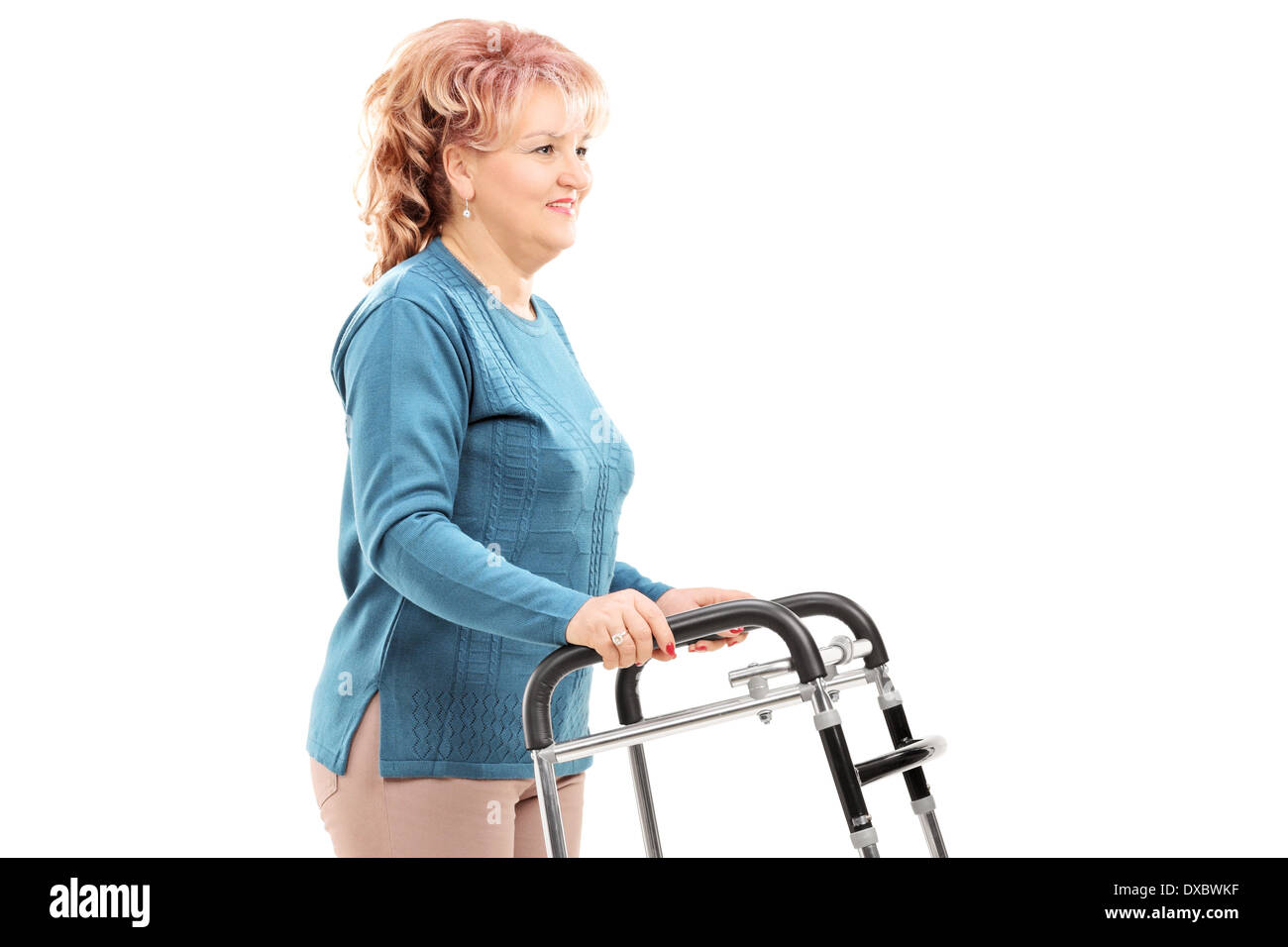 Mature woman walking with walker Stock Photo Alamy