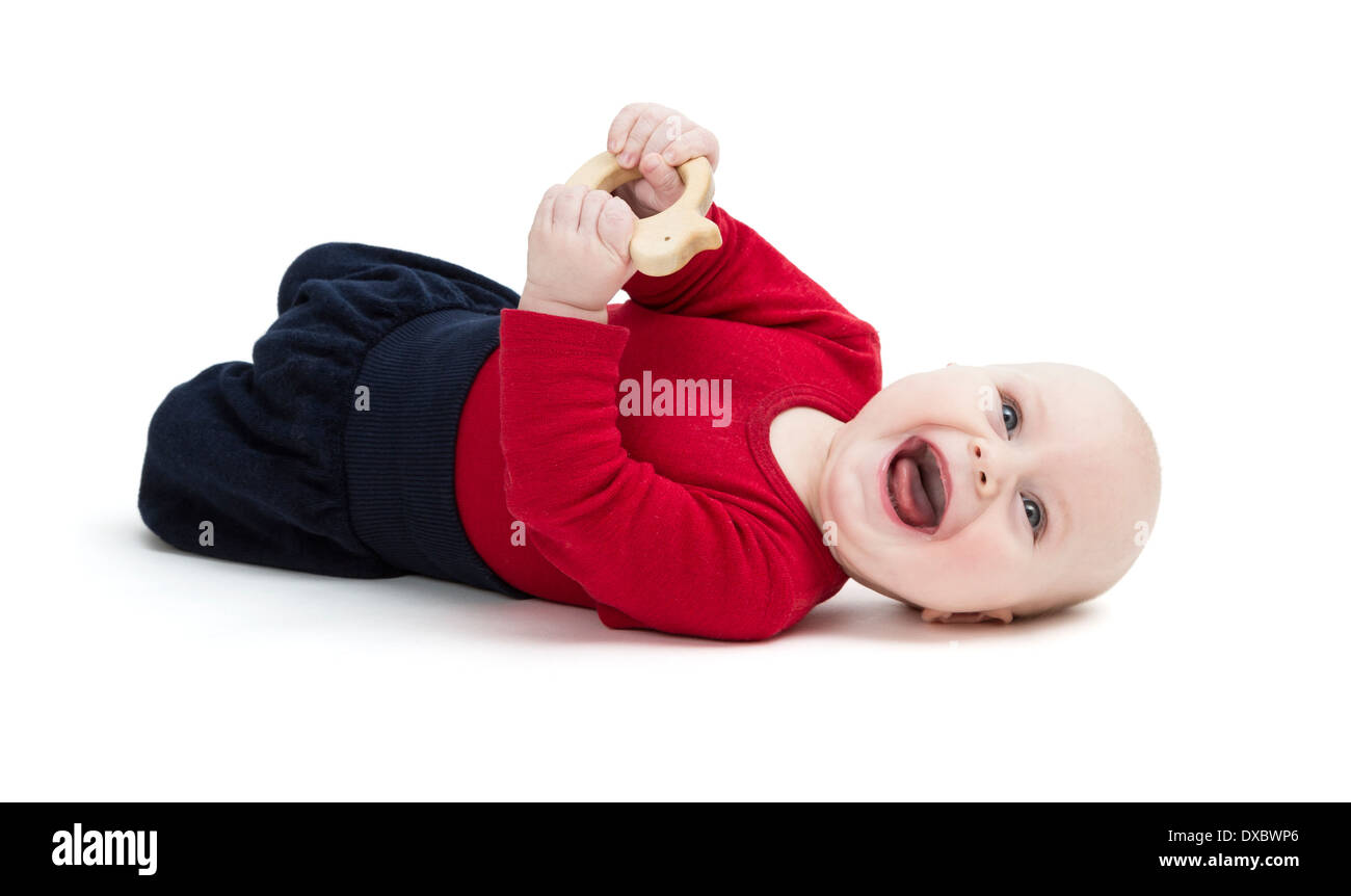 laughing baby in red shirt on floor. isolated on white background Stock Photo