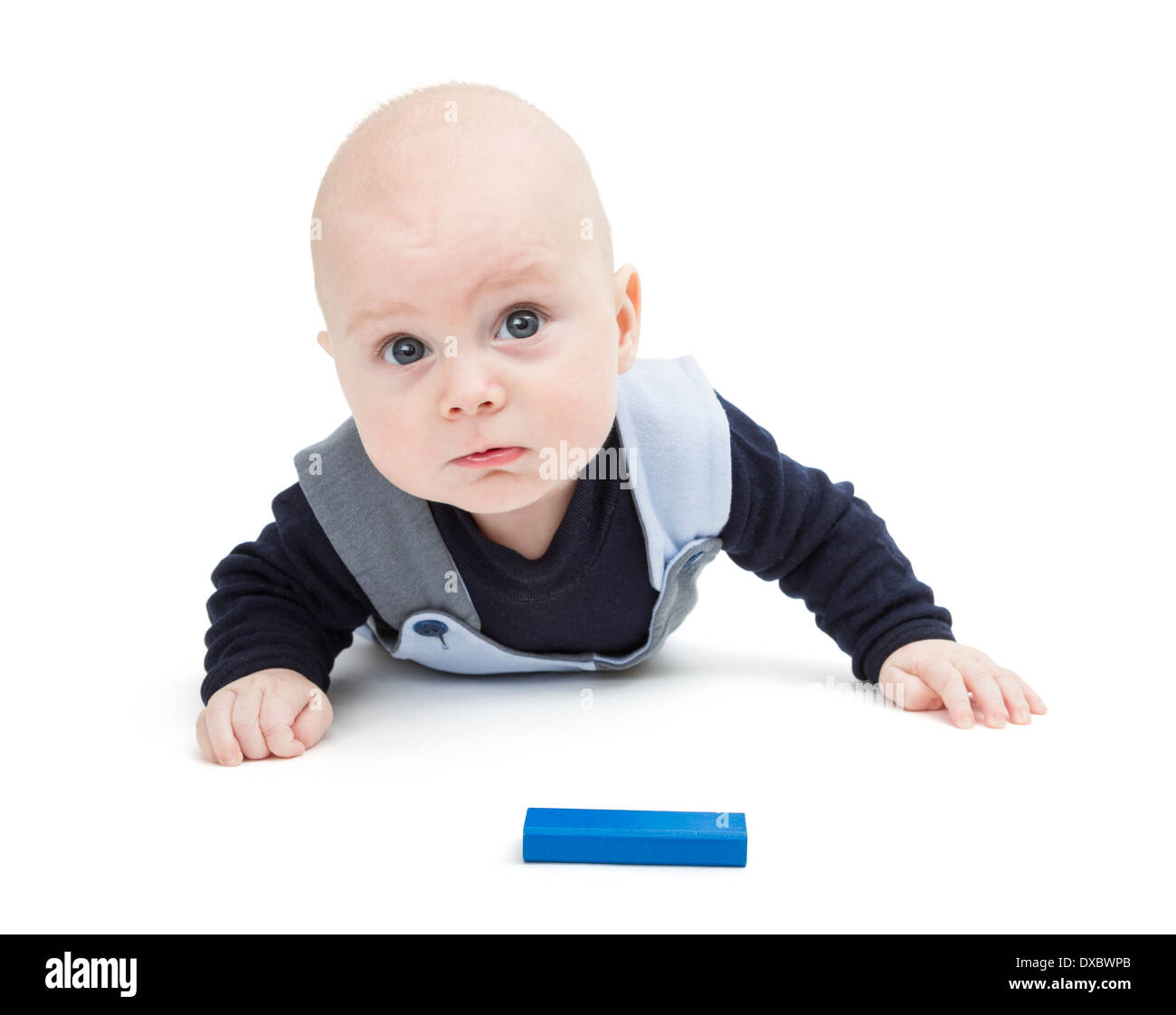 interested baby with toy block on floor isolated on white Stock Photo