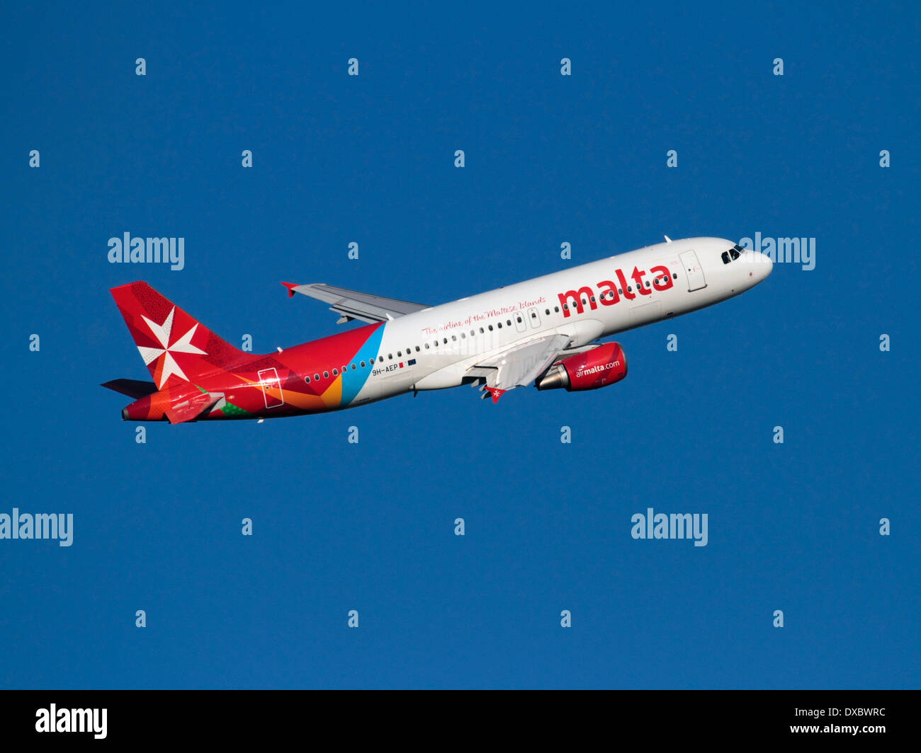 Air Malta Airbus A320 jet plane in flight on departure against a clear blue sky. Commercial flying and air travel. Stock Photo