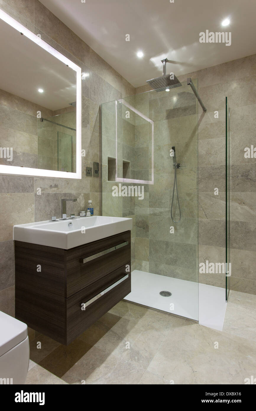 Luxury bathroom with Mandarin Stone tiling and floor Stock Photo Alamy