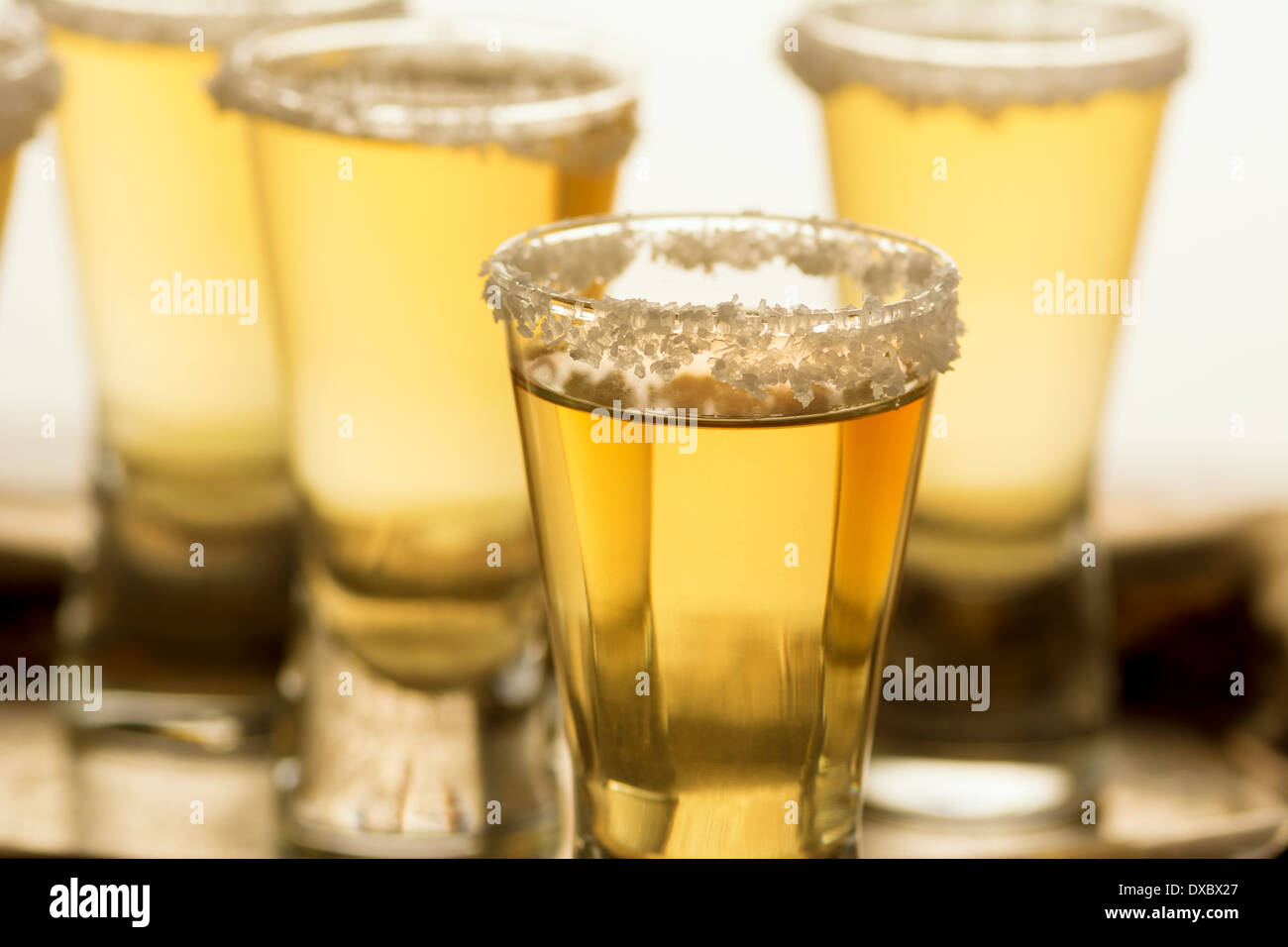 Group of Ripasso tequila shots with limes and salt Stock Photo