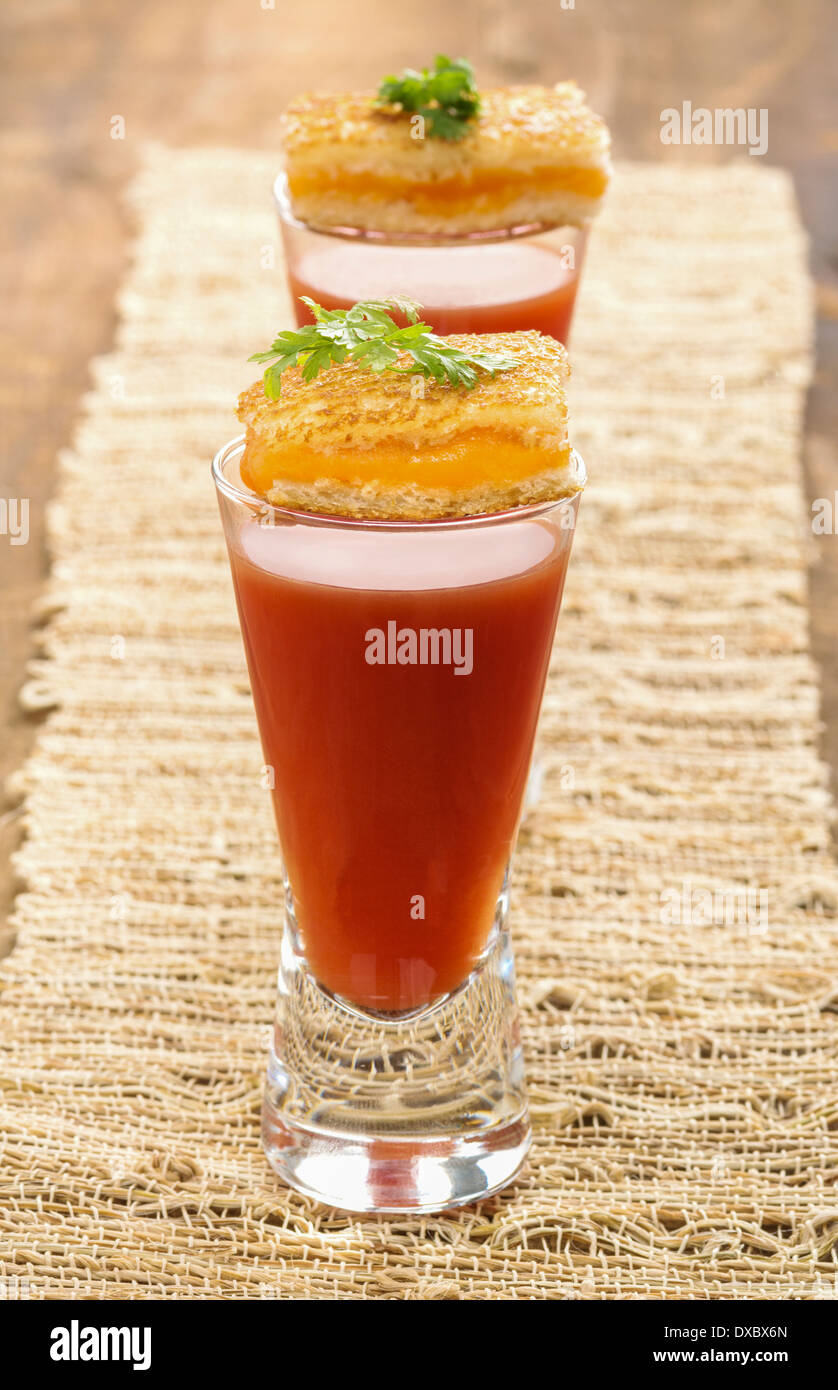 Tomato soup shooters with mini grilled cheese appetizers Stock Photo