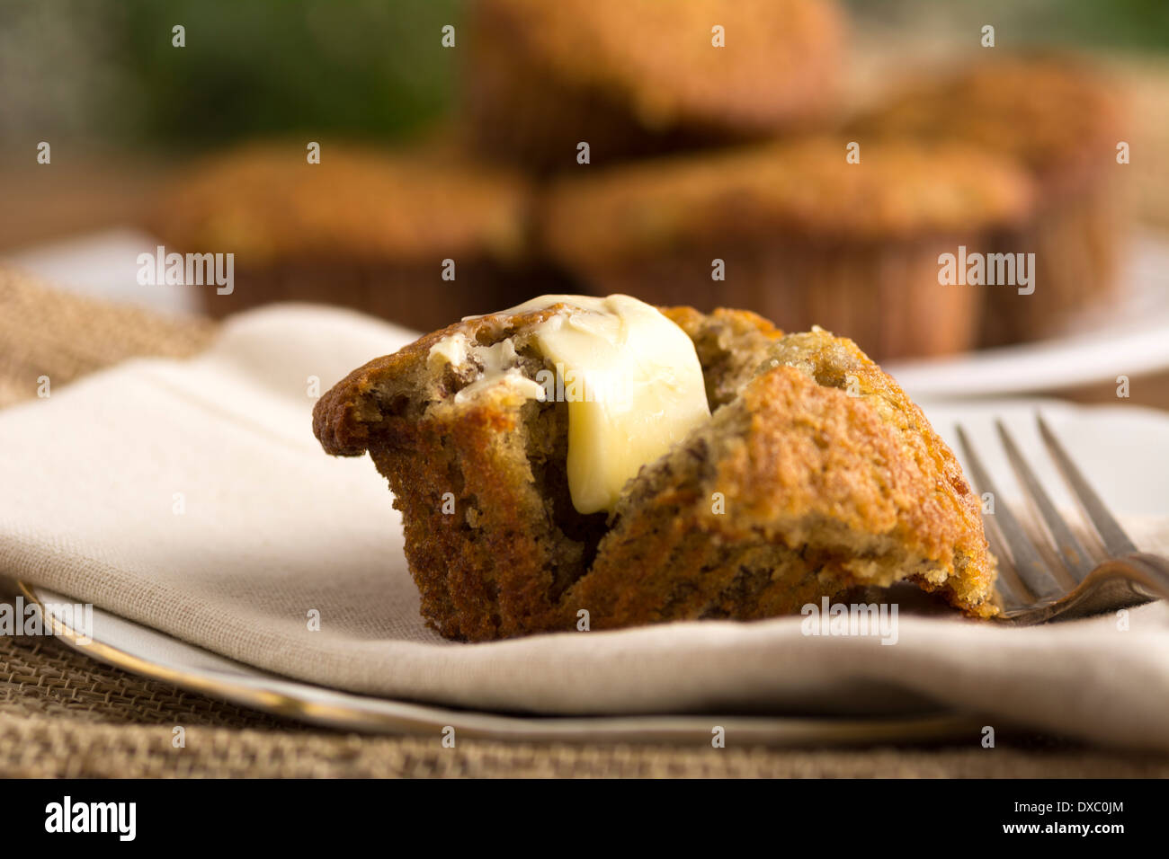Fresh homemade banana muffin with melted butter Stock Photo