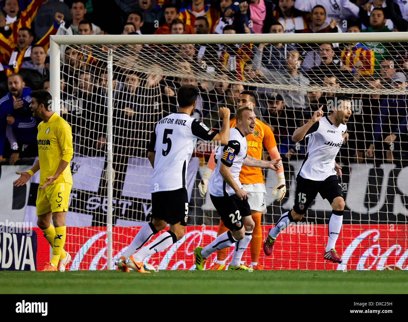 Valencia, Spain. 23rd Mar, 2014. Forward Javi Fuego of Valencia CF (R) celebrates after scoring the second goal for his team during the La Liga Game between Valencia CF and Villarreal at Mestalla Stadium, Valencia © Action Plus Sports/Alamy Live News Stock Photo
