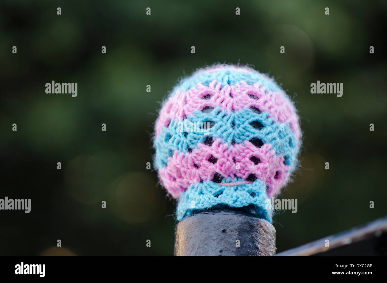 Yarn bombing, knitted sleeve around a post in Fuengirola, Spain Stock Photo