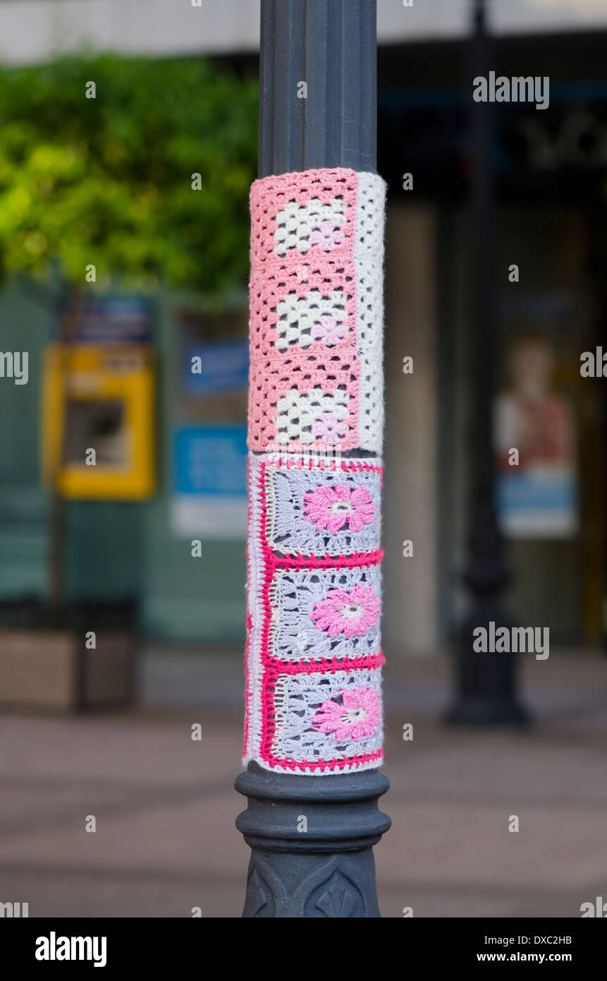 Yarn bombing, knitted sleeve around a lamppost in Fuengirola, Spain Stock Photo