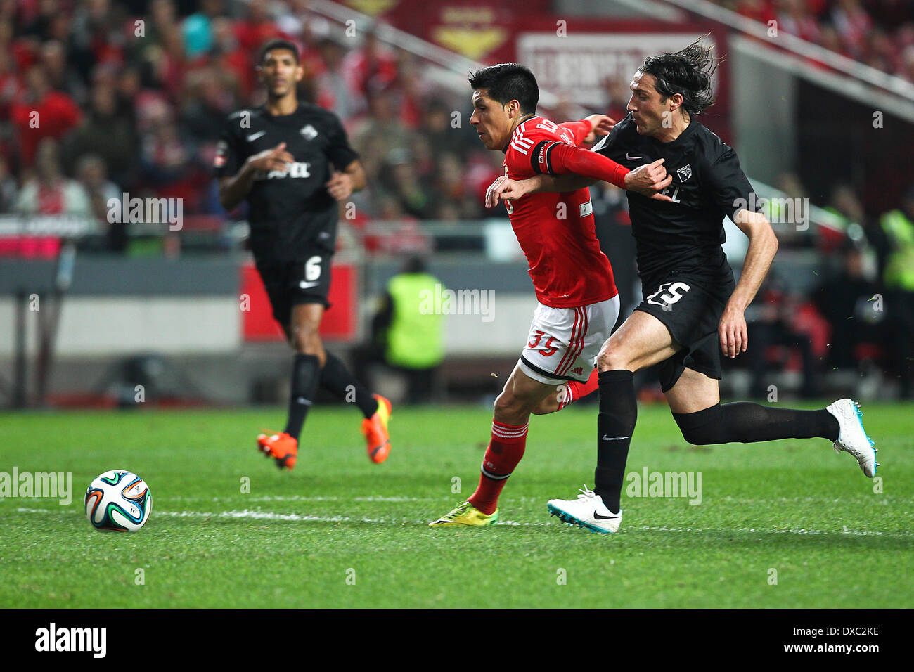 Lisbon, Portugal. 23rd Mar, 2014. Benfica's Argentine midfielder Enzo Perez (L) challenges Academica player Fernando Alexandre (R) before scoring the third goal for Benfica during a soccer match between SL Benfica and Academica in the Portuguese Premier League, at Benfica's Luz Stadium in Lisbon, on March 23, 2014. © Action Plus Sports/Alamy Live News Stock Photo