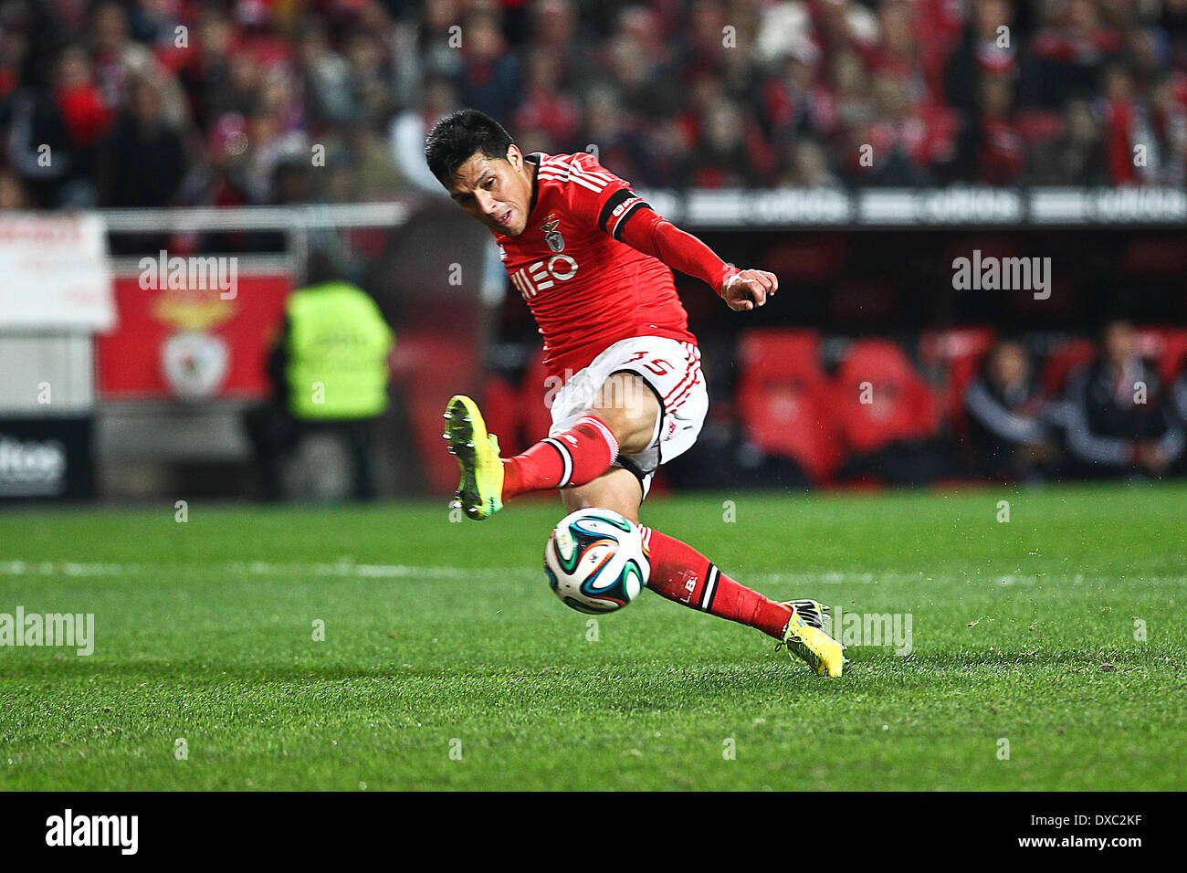Lisbon, Portugal. 23rd Mar, 2014. Benfica's Argentine midfielder Enzo Perez scoring the third goal for Benfica during a soccer match between SL Benfica and Academica in the Portuguese Premier League, at Benfica's Luz Stadium in Lisbon, on March 23, 2014. © Action Plus Sports/Alamy Live News Stock Photo