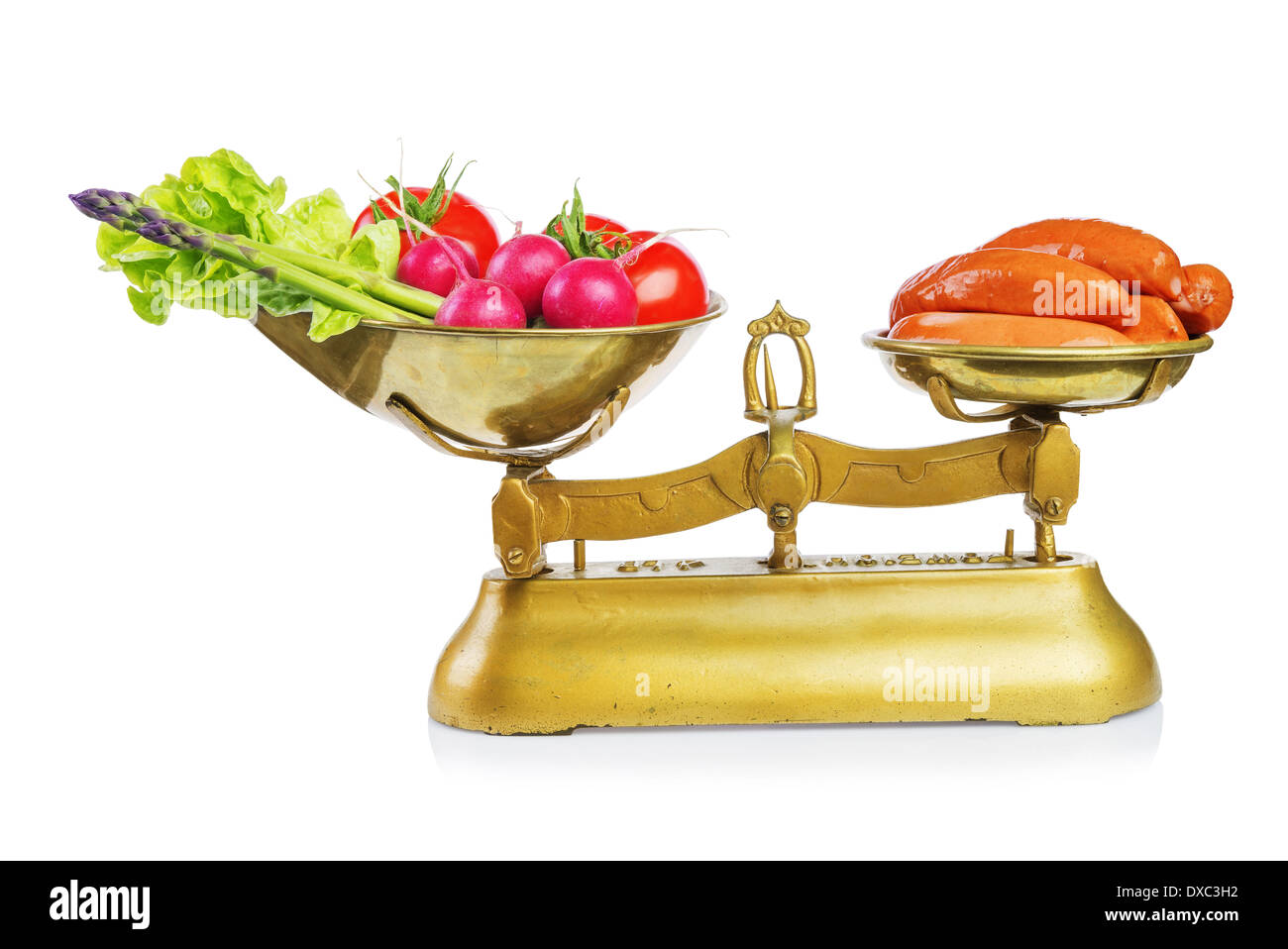 Healthy food and unhealthy food on scales.Dieting concept.Isolated. Stock Photo