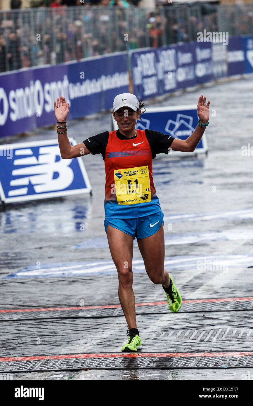 Rome, Italy – March 23, 2014: Italian runner Emma Quaglia, 3rd, crosses the  finish line of the 20th edition of the Rome Marathon in 2 hours, 43 minutes  and 24 seconds. The