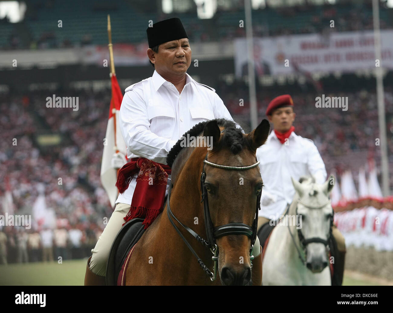 Central Jakarta, Jakarta, Indonesia. 23rd Mar, 2014. PRABOWO SUBIANTO (Center), the presidential candidate for the Great Indonesia Movement or Gerindra, parades on horseback as he inspects a roll call of supporters as he attends a campaign gathering ahead of the legislative elections in Gelora Bung Karmo Staduim. PRABOWO SUBIANTO, the former commander of Indonesia's special forces or Kopassus, is the main rival for popular governor of Jakarta, Joko Widodo, who is also running for president in the country's presidential election on July 9, which will follow a legislative vote on April 9. (Cre Stock Photo
