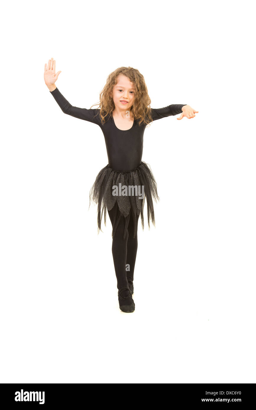 Little girl dancing and make her choreography isolated on white background Stock Photo