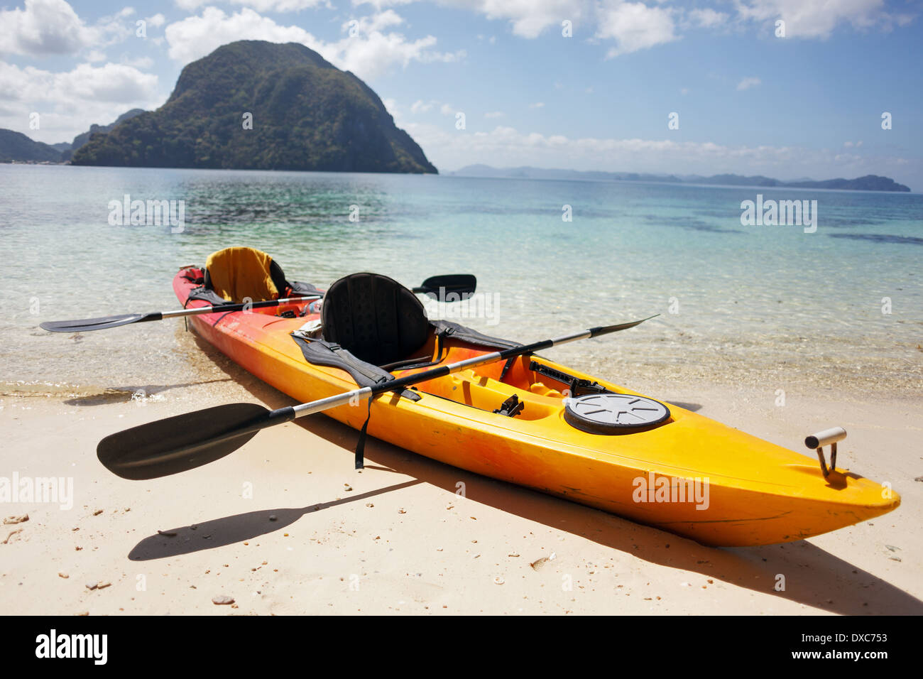Sea kayak at the lonely sandy beach Stock Photo