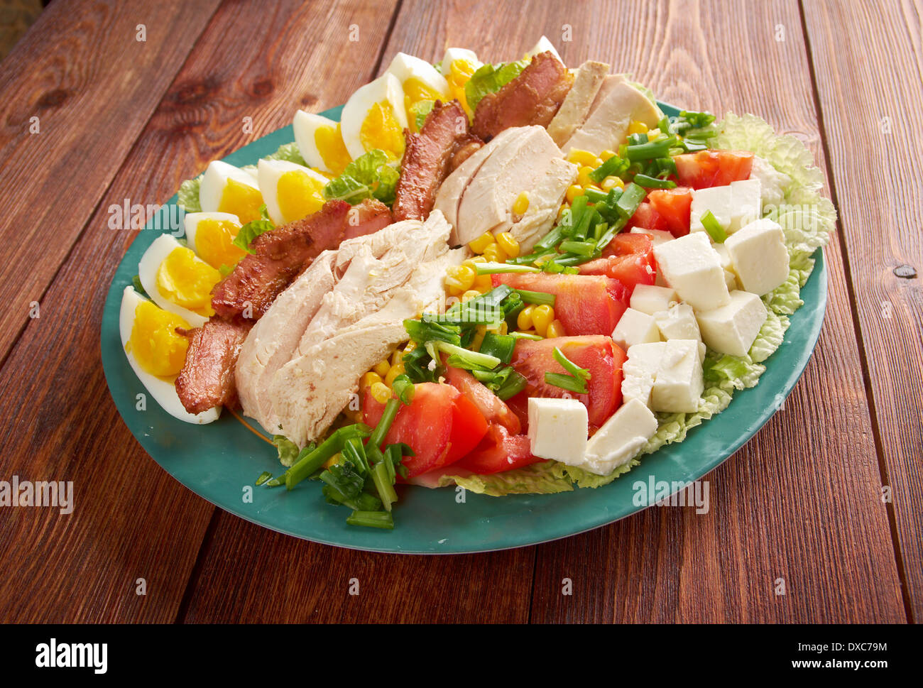 Cobb Salad - Colorful hearty entree sized salad with bacon, chicken, boiled eggs, corn, - a main-dish American garden salad  Stock Photo