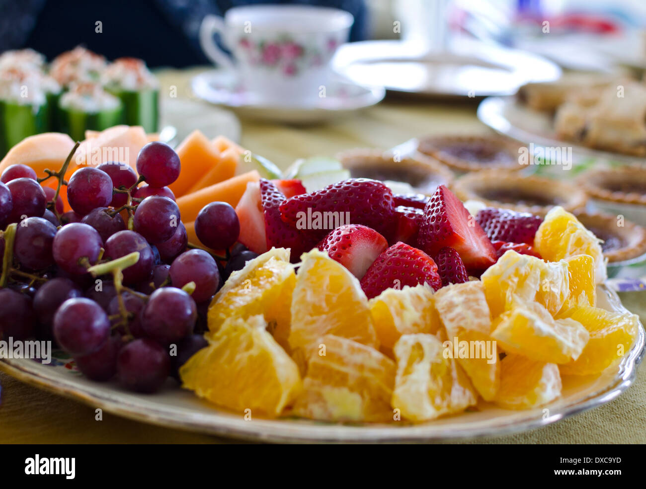 Plate of cut up fruit -oranges, grapes, strawberries and cantaloupe ... Plate of cut up fruit -oranges, grapes, strawberries and cantaloupe ...