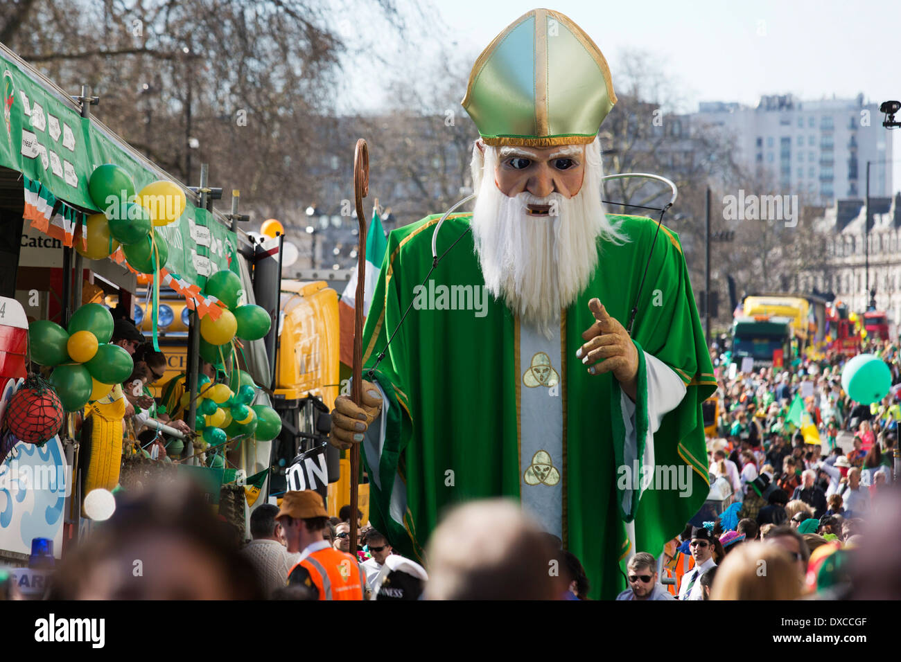 A 5m-tall St Patrick created by Emergency Exit Arts winds its way down the parade. St Patrick's Day Parade in Central London. Stock Photo