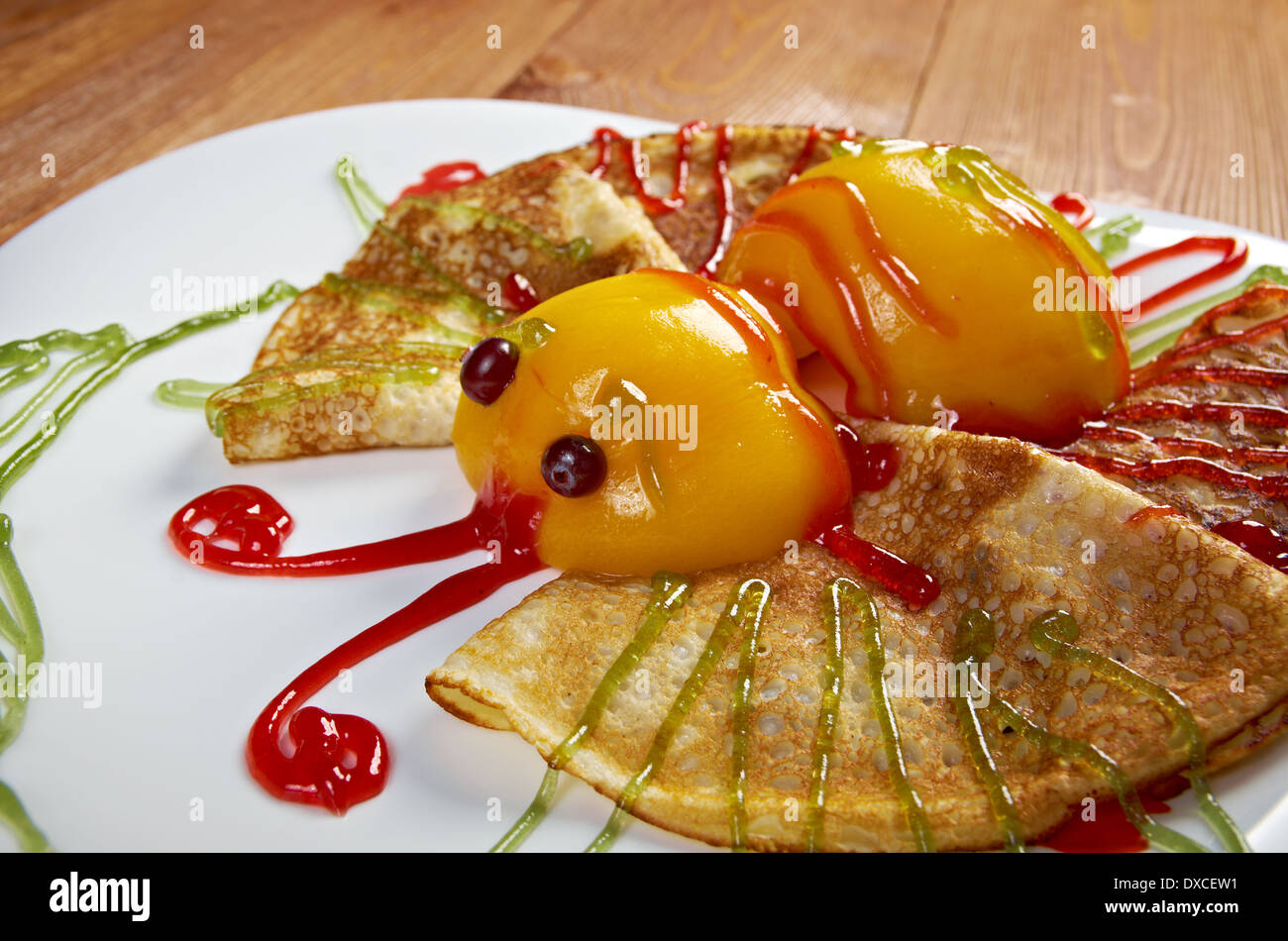 Kids Food.Fun butterfly shaped pancake with peach Stock Photo
