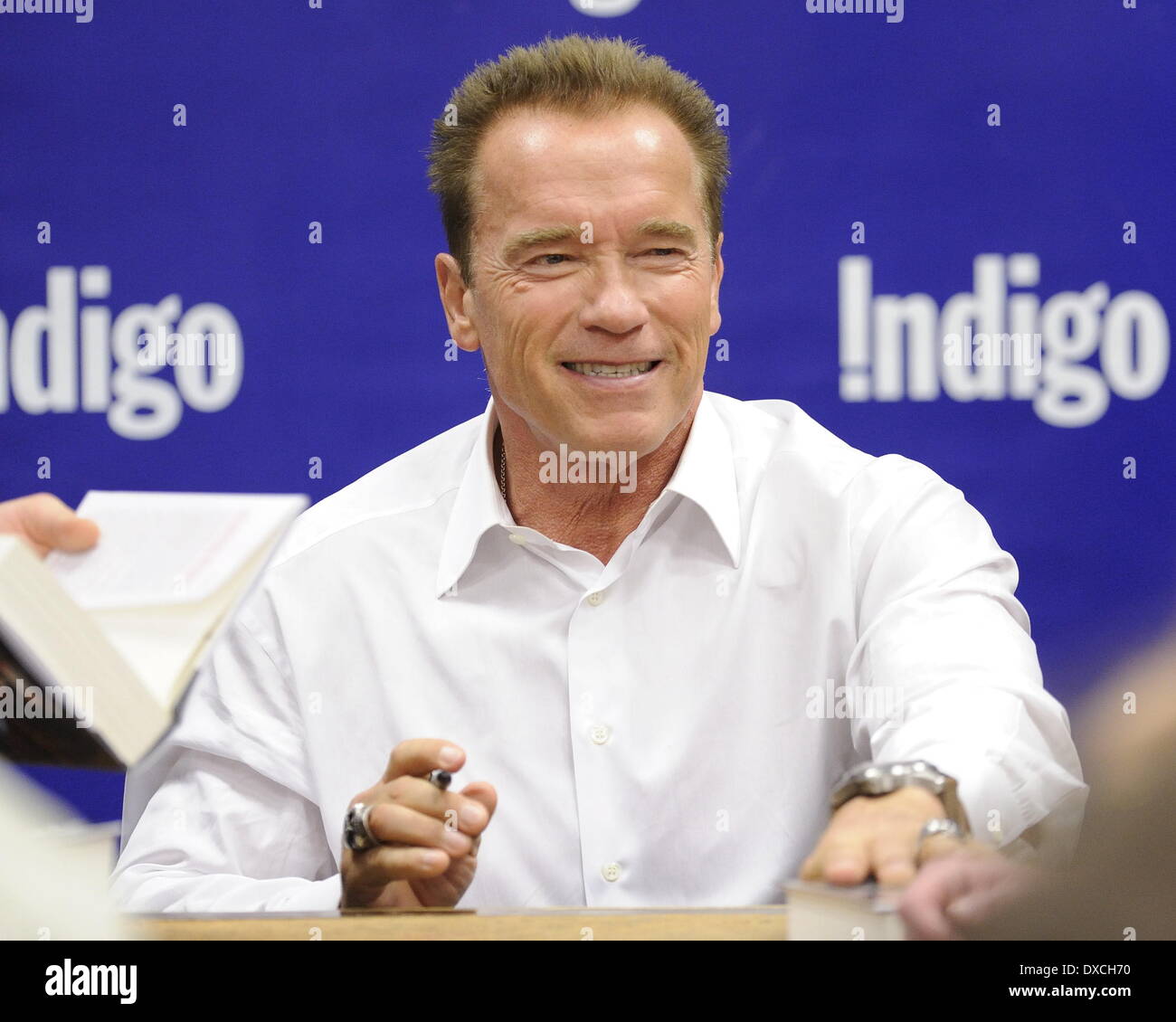 Arnold Schwarzenegger attends a book signing at Indigo Manulife Centre