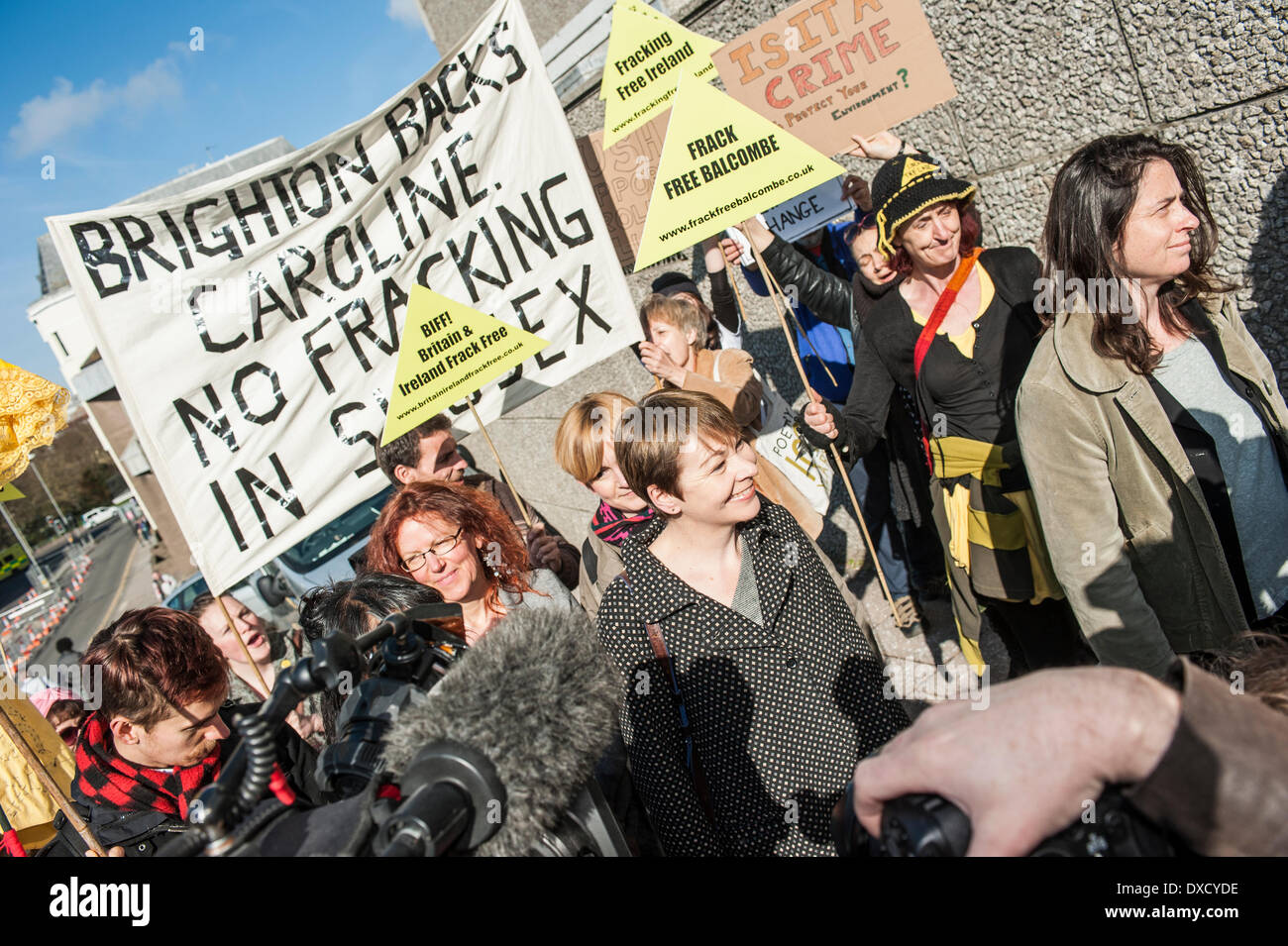 Brighton, Sussex, UK. 24th March 2014. Caroline Lucas, Green Party MP for Brighton Pavillion, arriving at Brighton Magistrates Court for day one of the trial following her arrest last August at the anti-fracking protests at Balcombe. Caroline Lucas was taking part in a peaceful direct action protest against fracking. She was charged, with four others, for obstructing the highway and failing to follow police instructions to move to a specified protest area. Caroline Lucas MP states on her blog that they will all plead not guilty. Credit:  Francesca Moore/Alamy Live News Stock Photo