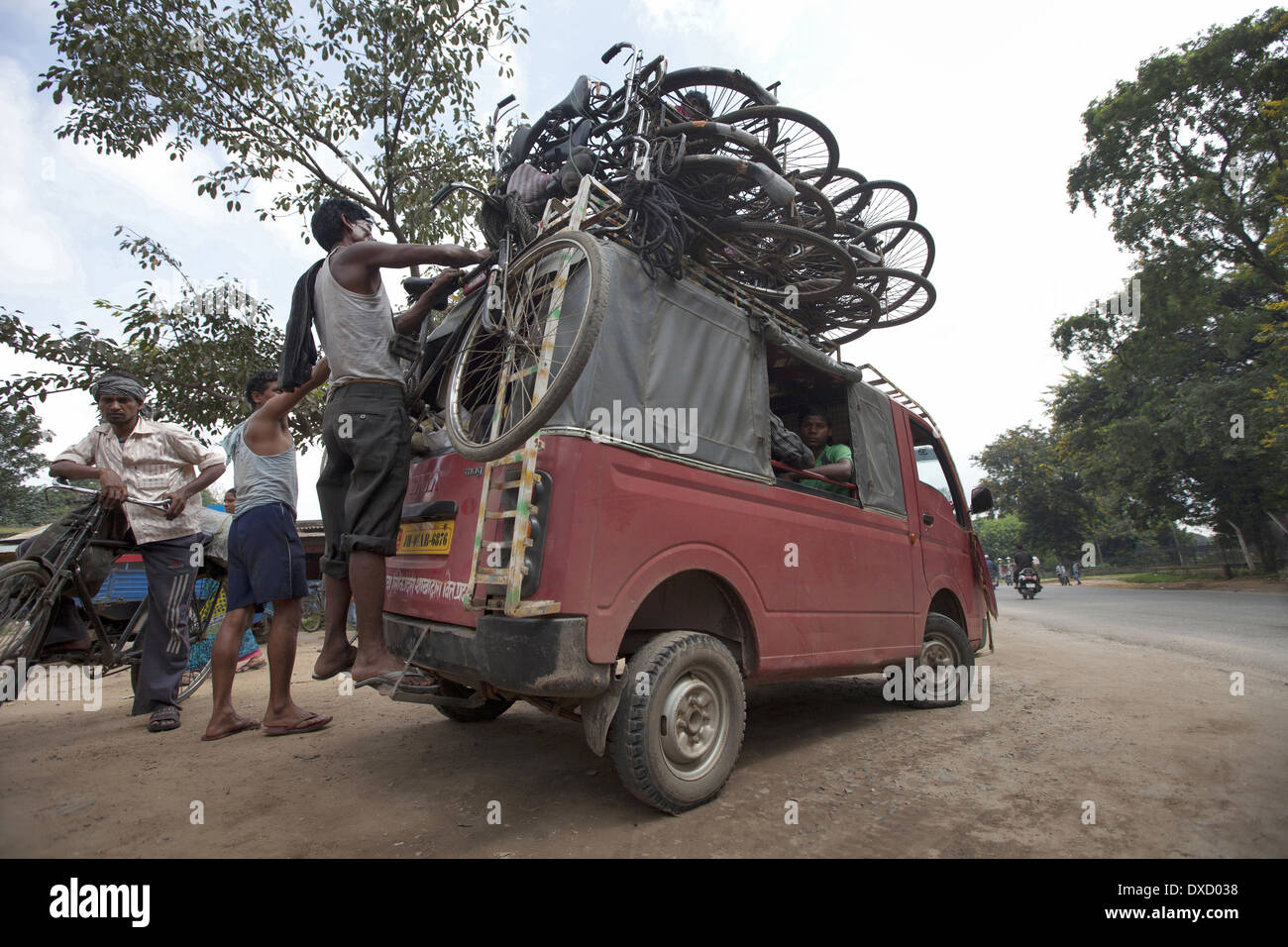 Coal carrier cycles loaded on a tempo. Kokar Chawk, Ranchi, Jharkhand, India Stock Photo