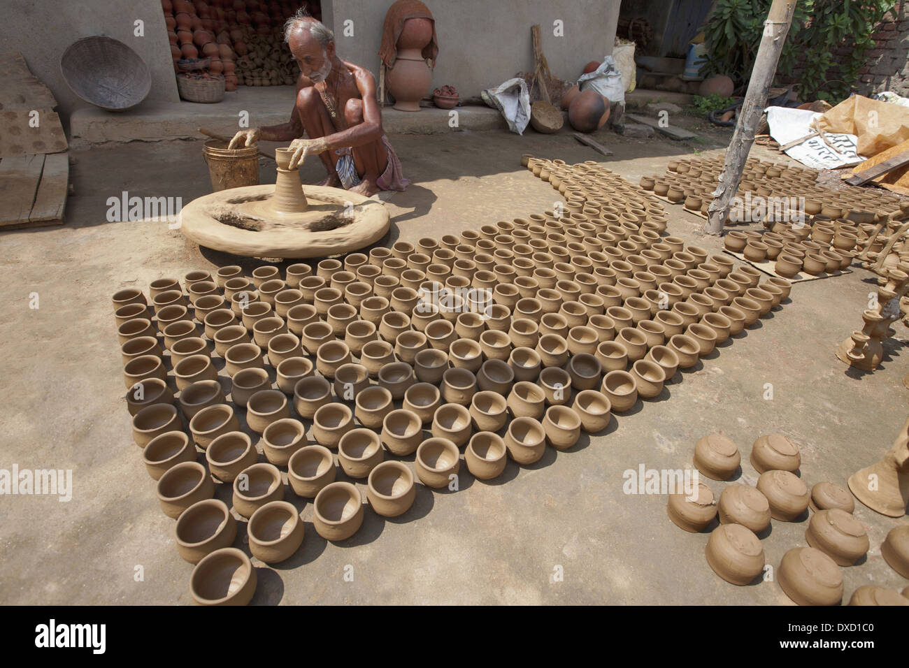 Potter making pots on a traditional wheel with special clay. Kumhartoli village, District Ranchi, Jharkhand, India Stock Photo