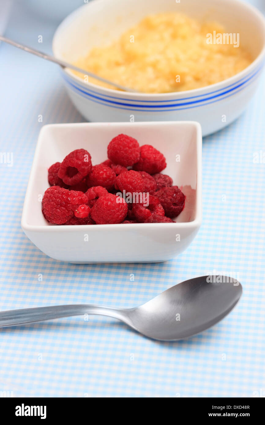 Mashed Raspberries Raspberries and mashed banana closeup on a kitchen table with for ...