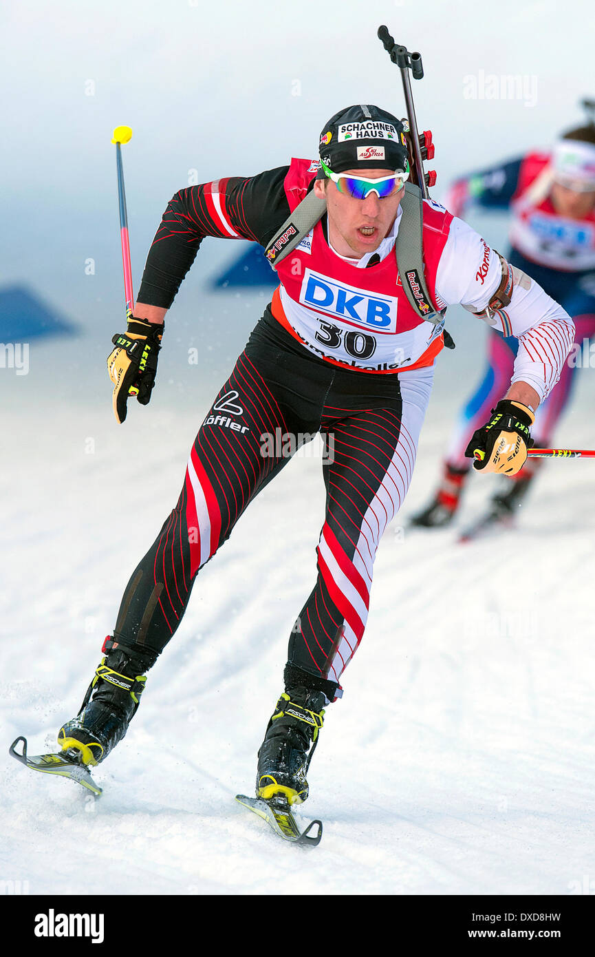 Oslo, Norway. 24th Mar, 2014. The E.ON World Cup Biathlon 2014 David Komatz of Austria competes in the men's 15 kilometre mass start during the World Cup Biathlon at Holmenkollen in Oslo, Norway. Credit:  Action Plus Sports Images/Alamy Live News Stock Photo