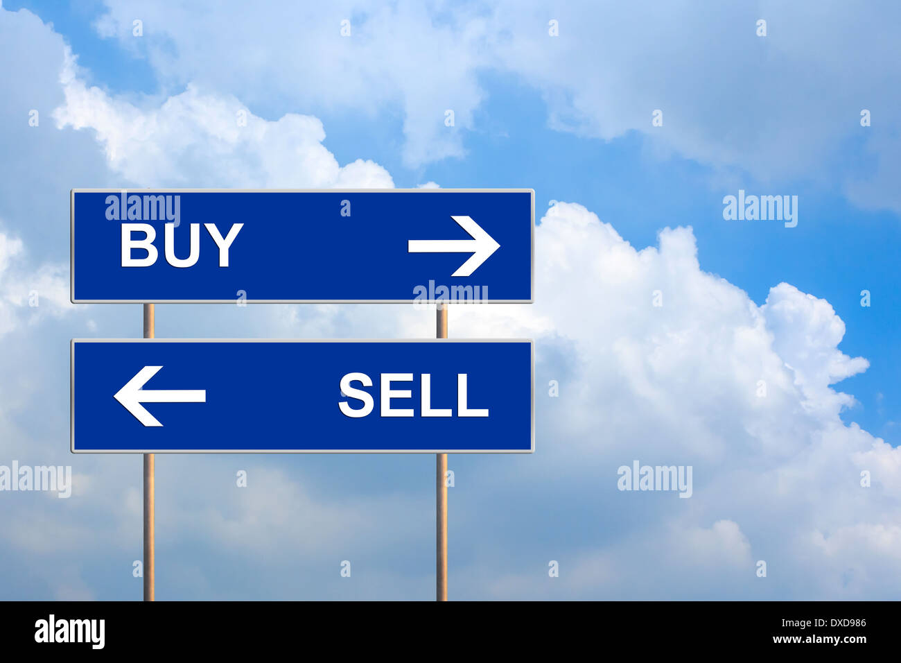buy and sell on blue road sign with blue sky Stock Photo