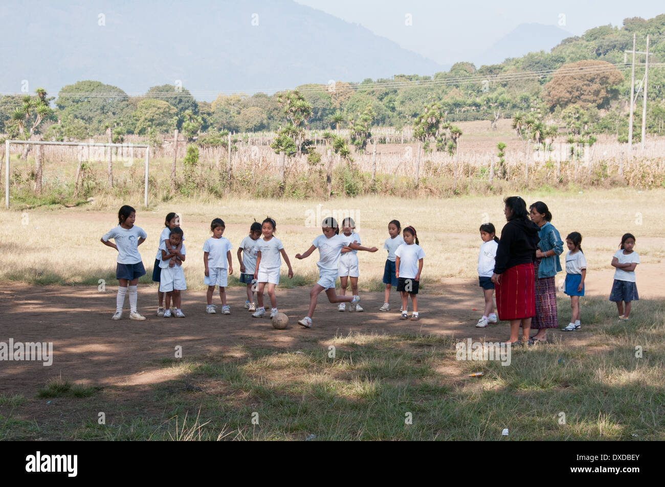 Schoolgirls in Guatemala playing soccer Stock Photo