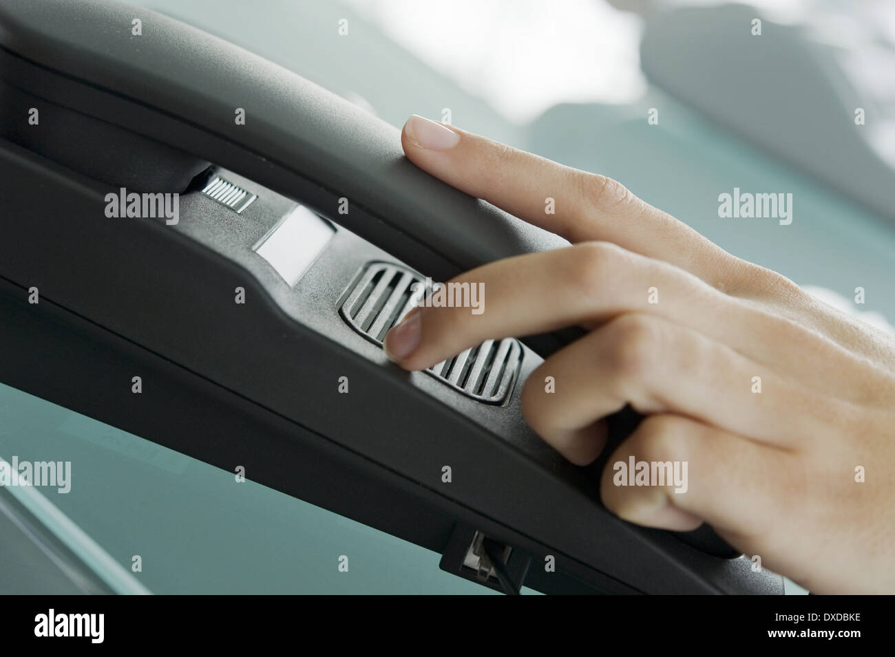 Closeup of woman's hand on telephone Stock Photo