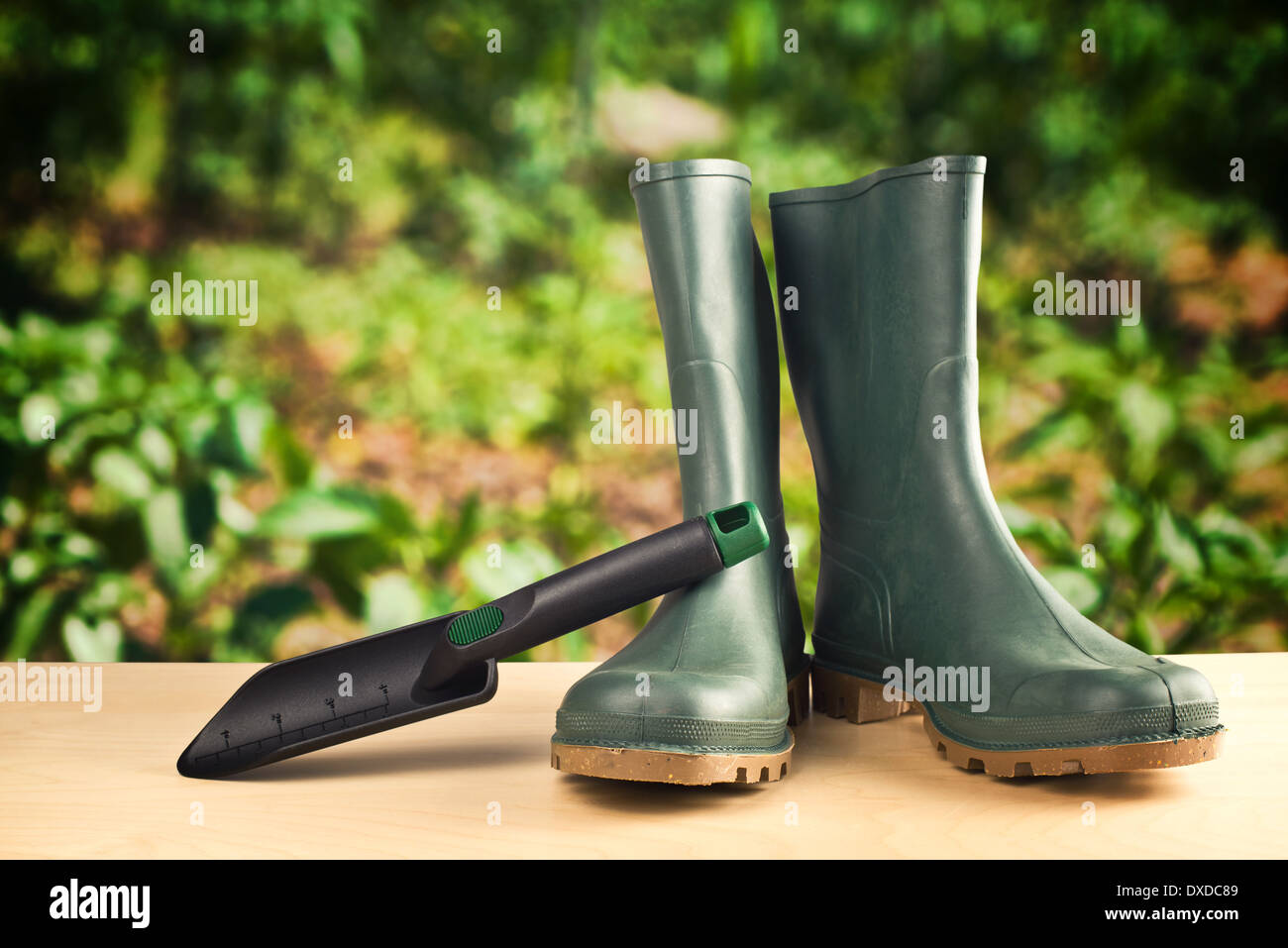 Green rubber boots. Agricultural working boots for all sorts of garden work. Stock Photo