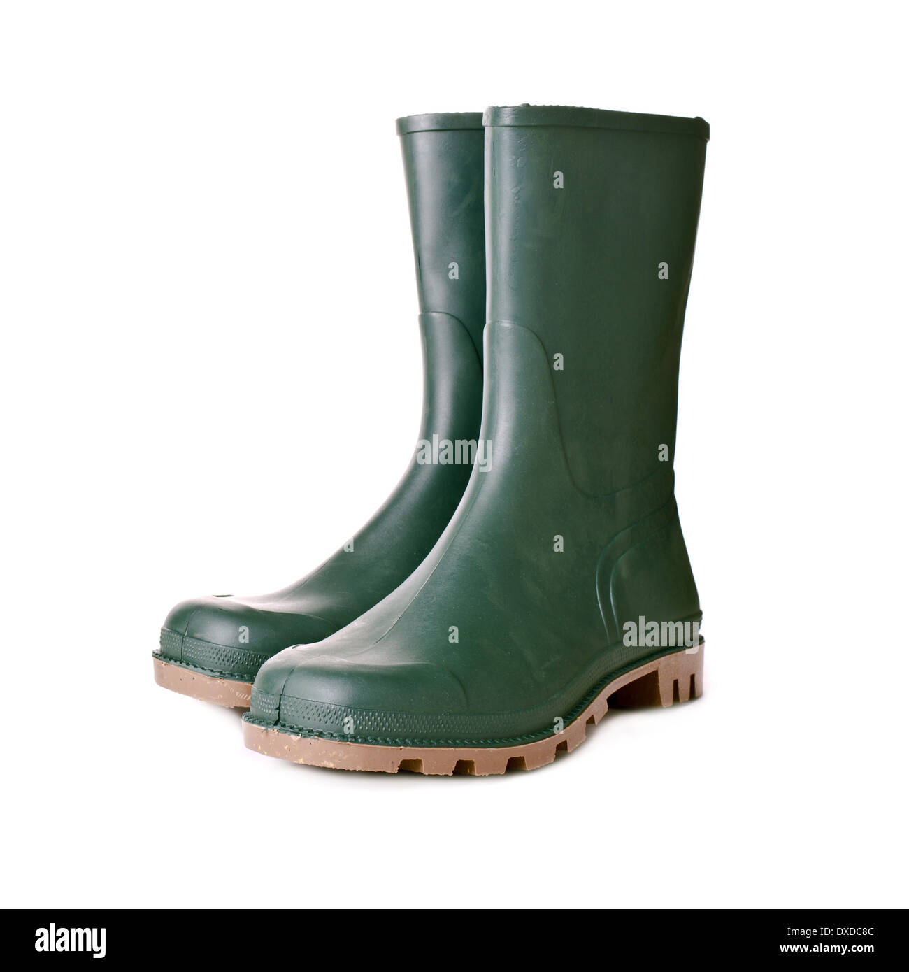 Green rubber boots on white background. Agricultural working boots for garden. Stock Photo