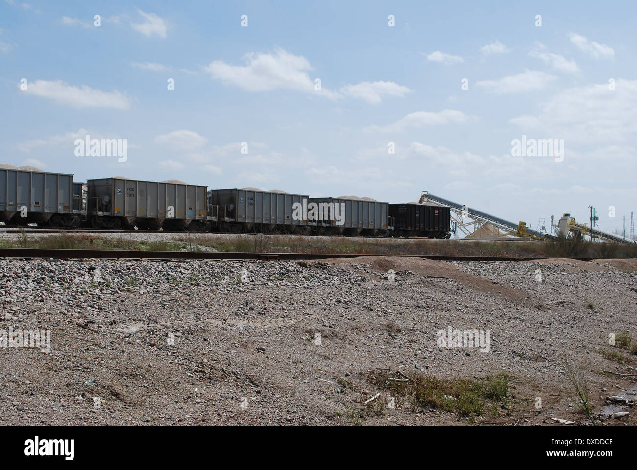 Texas Industries to merge with Martin Marietta Corporation in second quarter 2014. The TXI rail cars are being loaded  here. Stock Photo