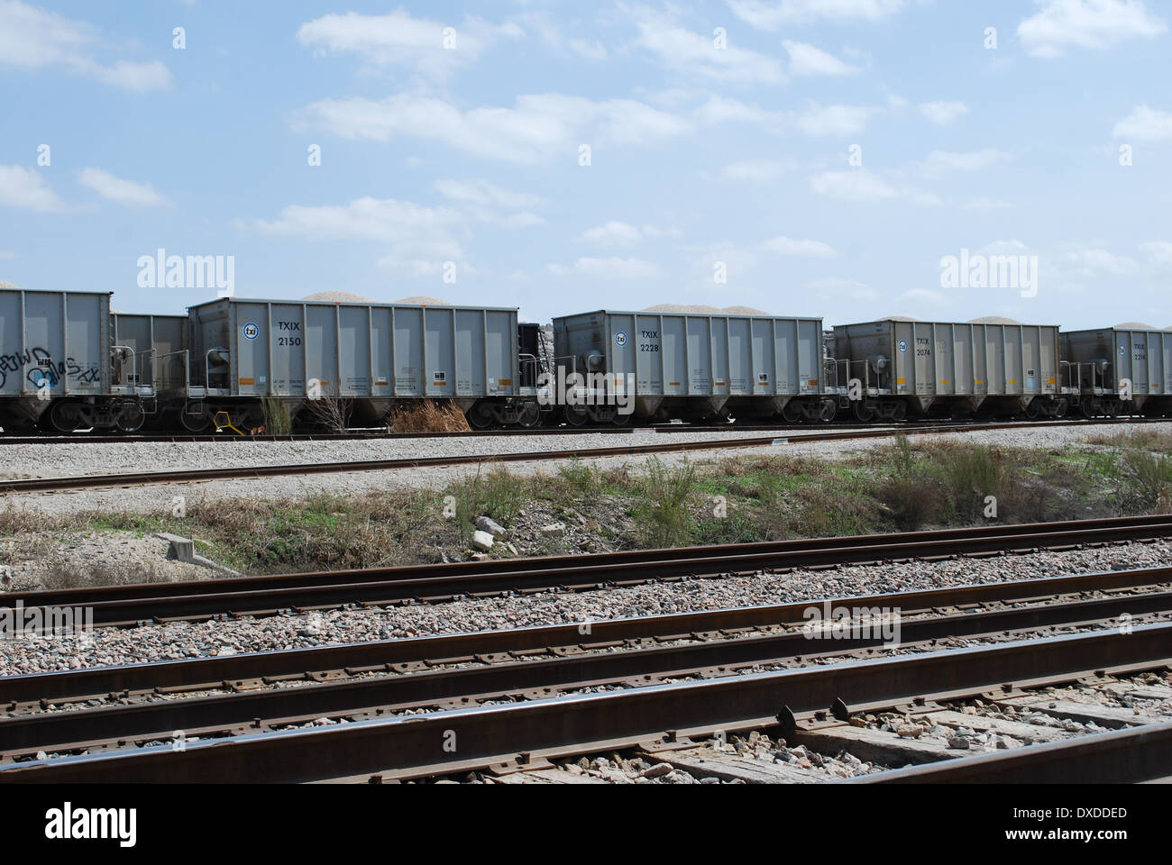 Texas Industries to merge with Martin Marietta Corporation in second quarter 2014. The TXI rail cars are being loaded  here. Stock Photo
