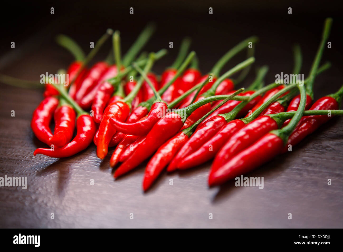Hot Thai Red Chili Peppers on table Stock Photo - Alamy