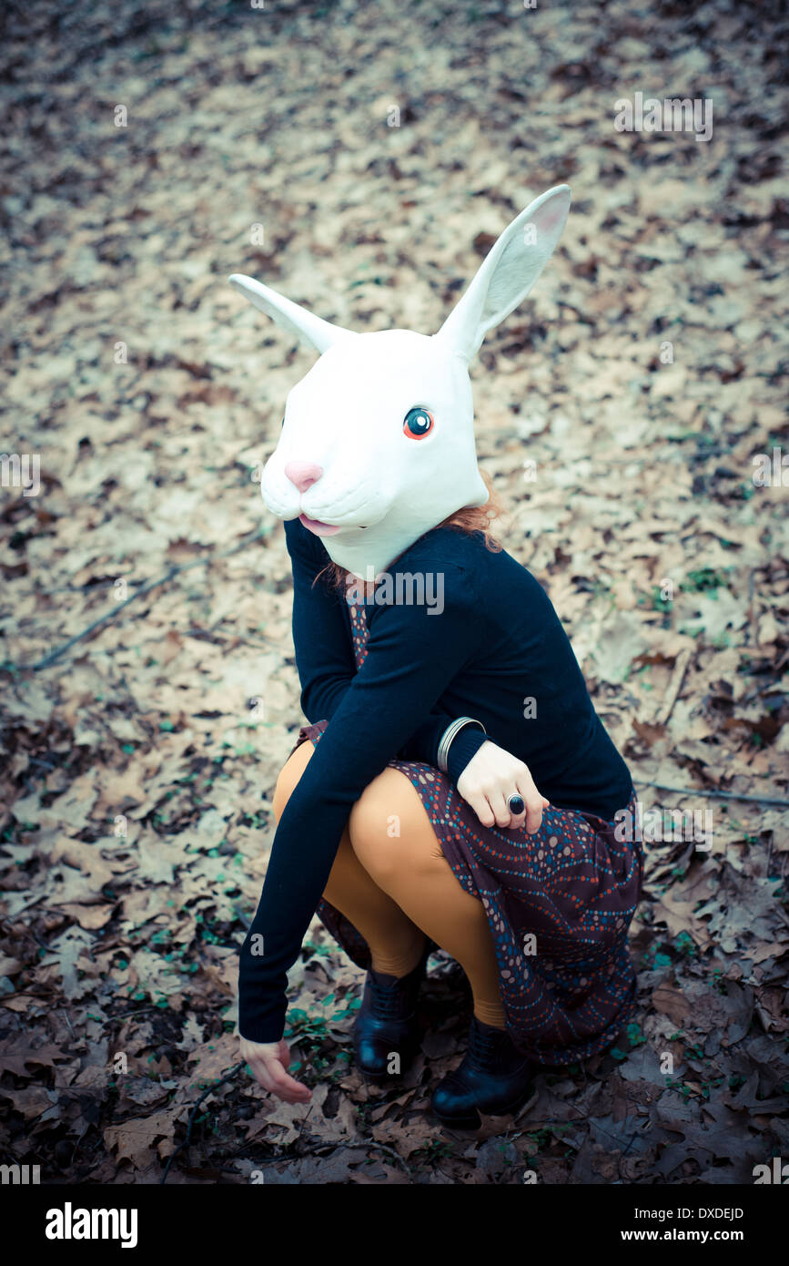 rabbit mask unreal woman at the park Stock Photo - Alamy