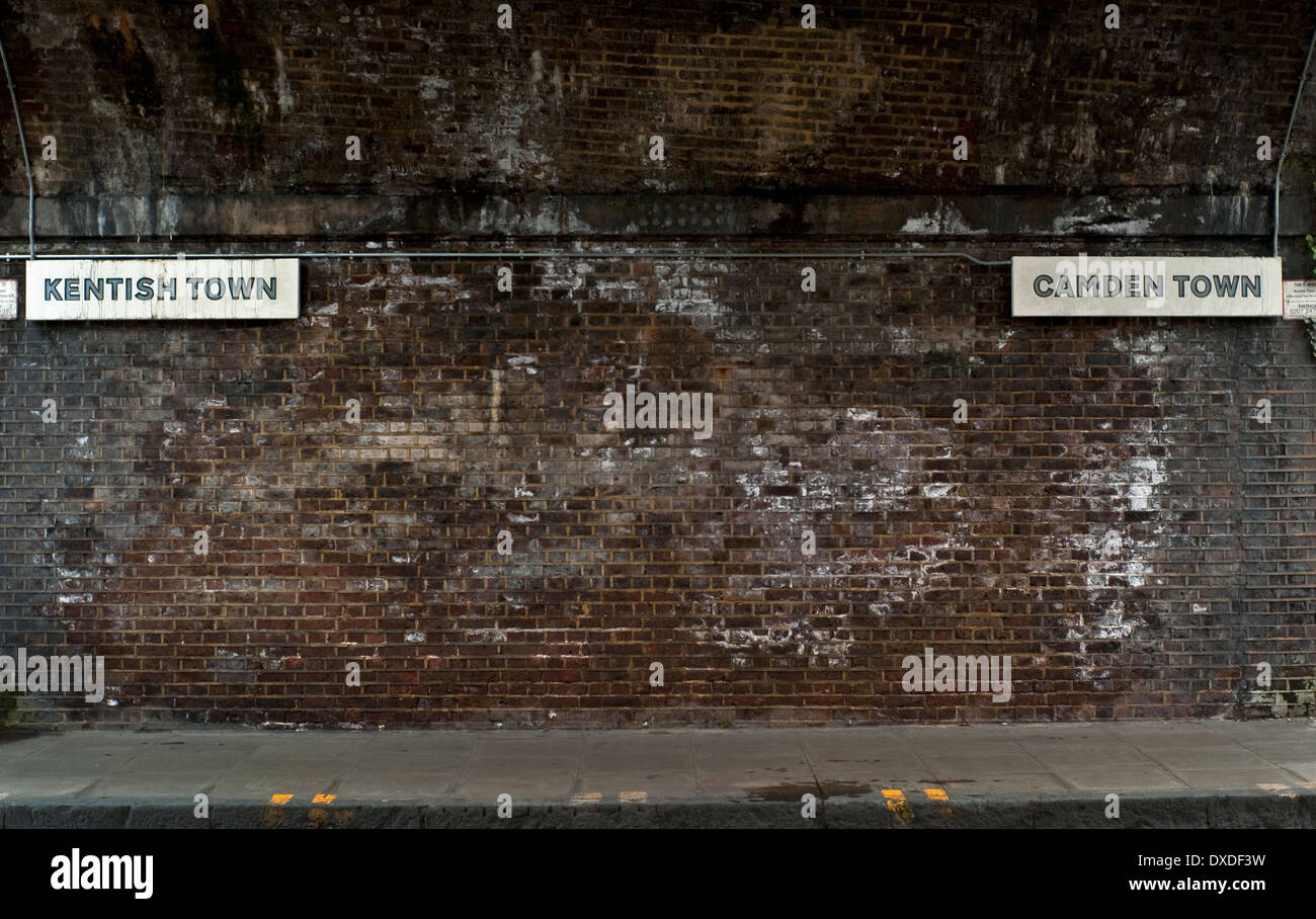 Kentish town and camden direction signs on railway bridge hires stock