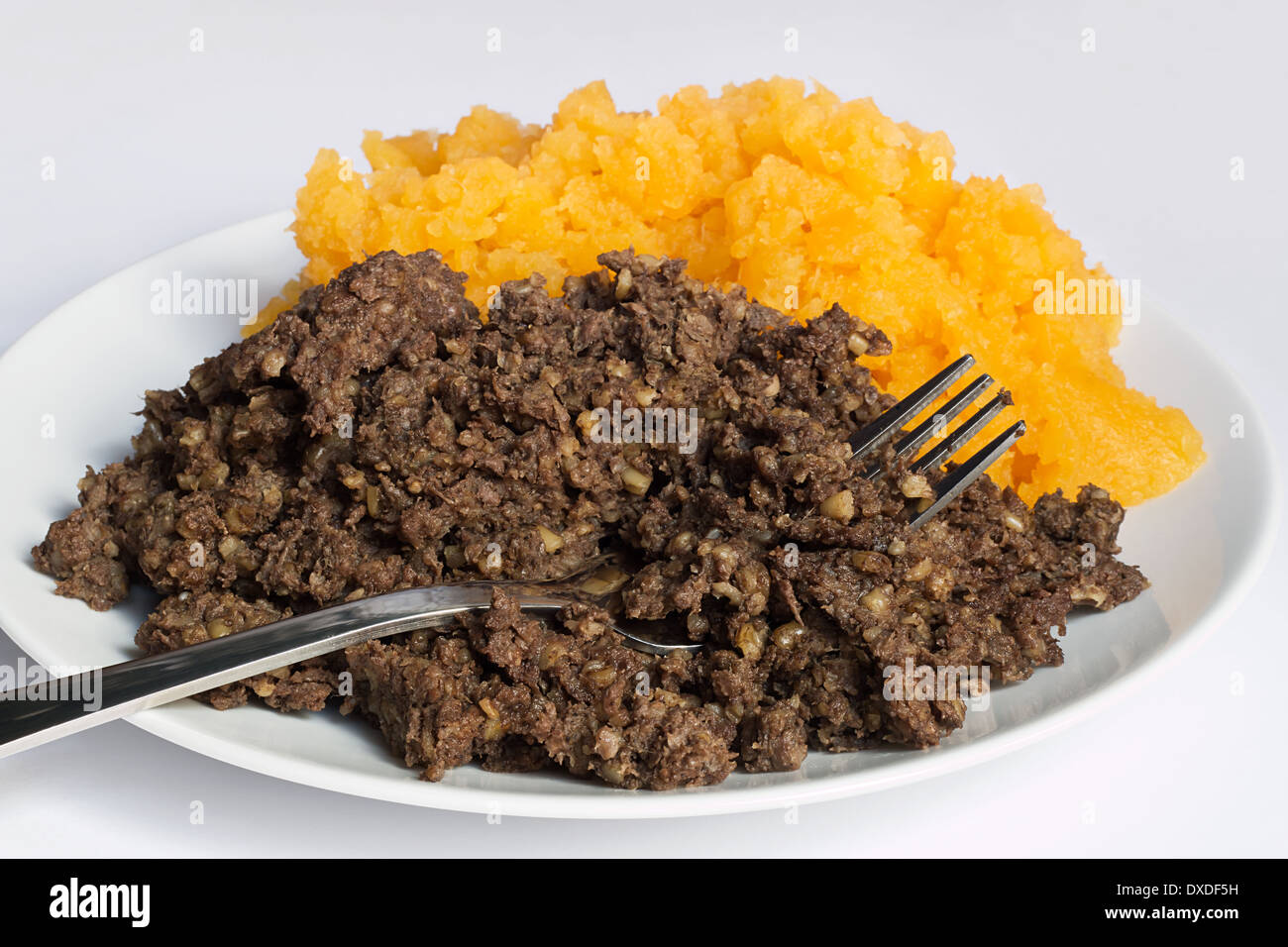 Traditional haggis and neeps close up, also called a burns supper in Scotland. Stock Photo